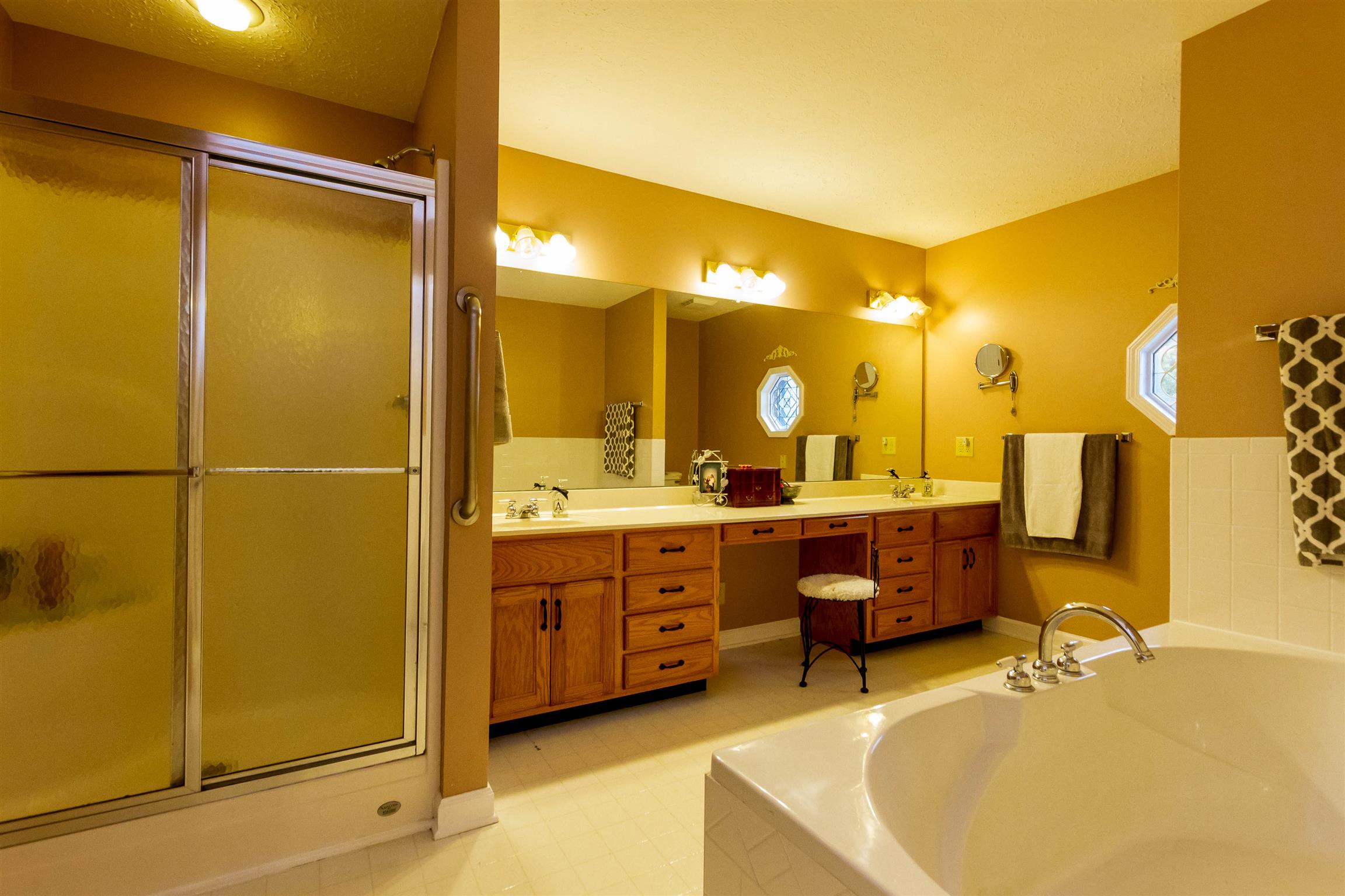 1941 Bradbury Road Adams, TN 37010 - Photo 17 of 30 a bathroom with a tub sink and mirror