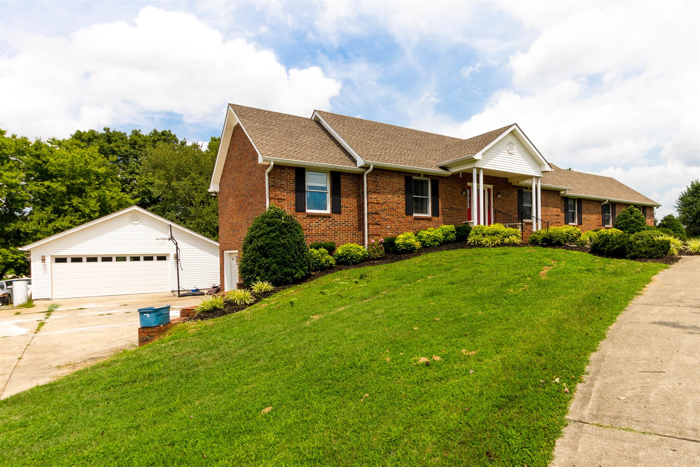1941 Bradbury Road Adams, TN 37010 - Photo 2 of 30 a front view of a house with a yard