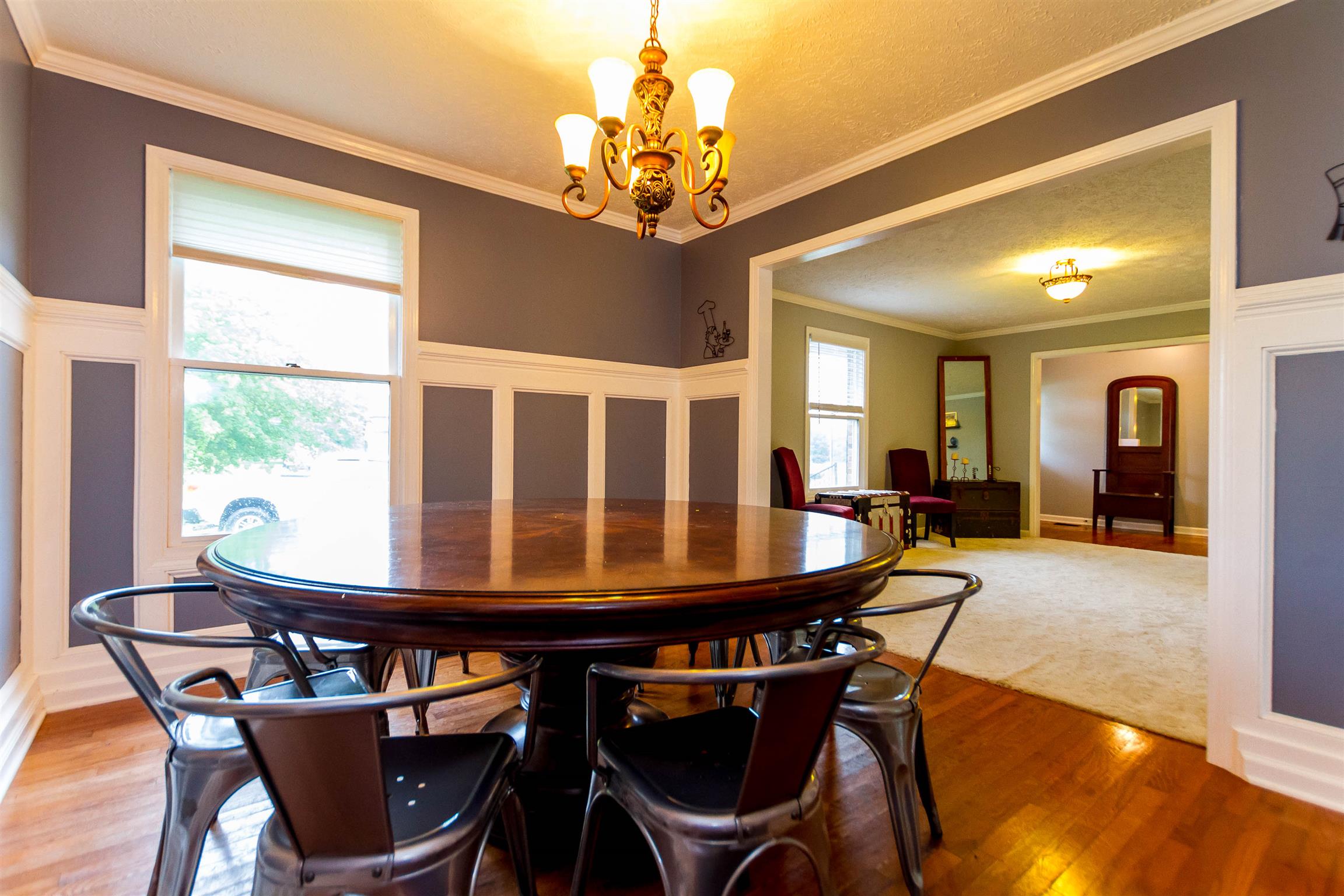 1941 Bradbury Road Adams, TN 37010 - Photo 22 of 30 a dining room with furniture a chandelier and wooden floor