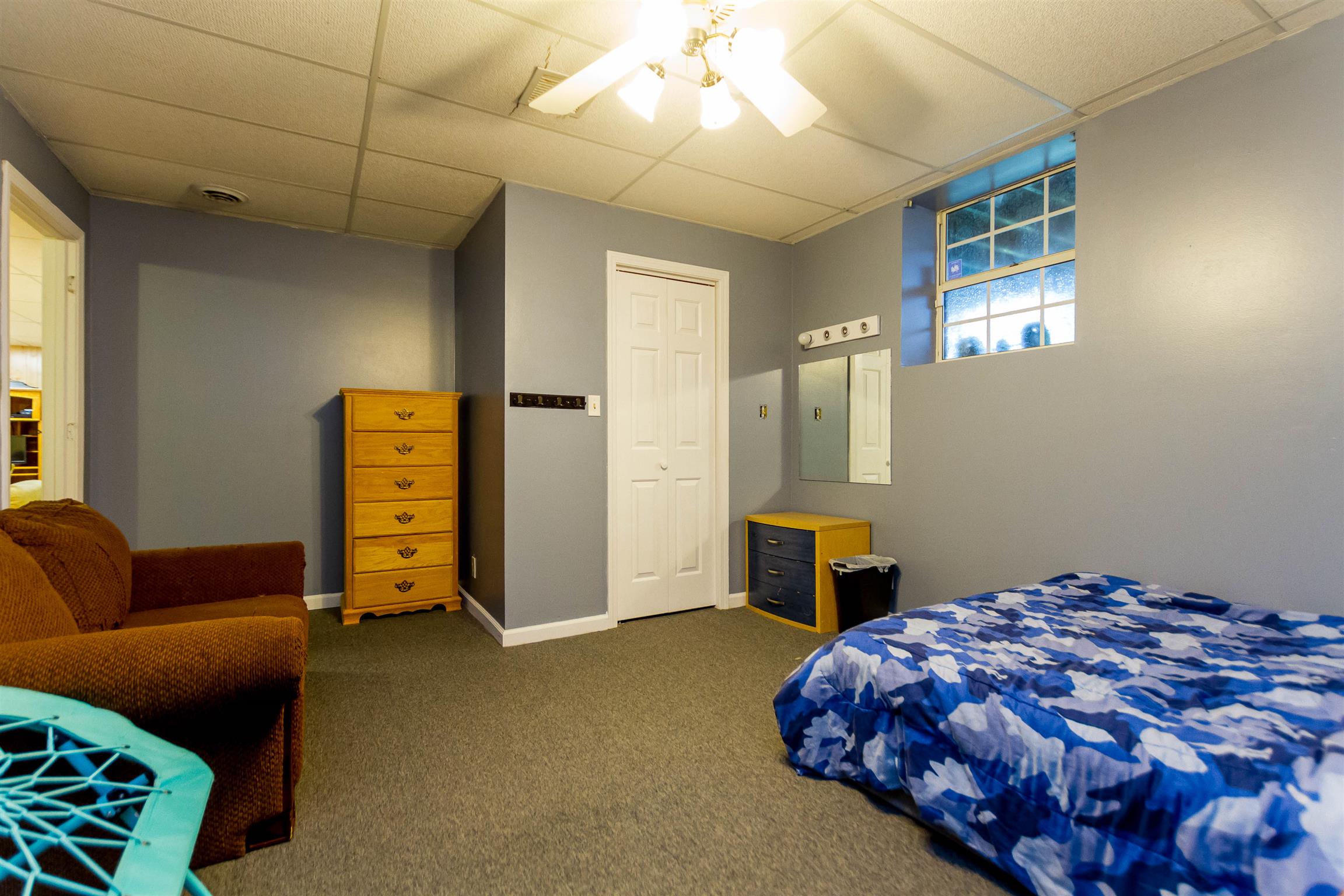 1941 Bradbury Road Adams, TN 37010 - Photo 27 of 30 a bedroom with a bed and a couch