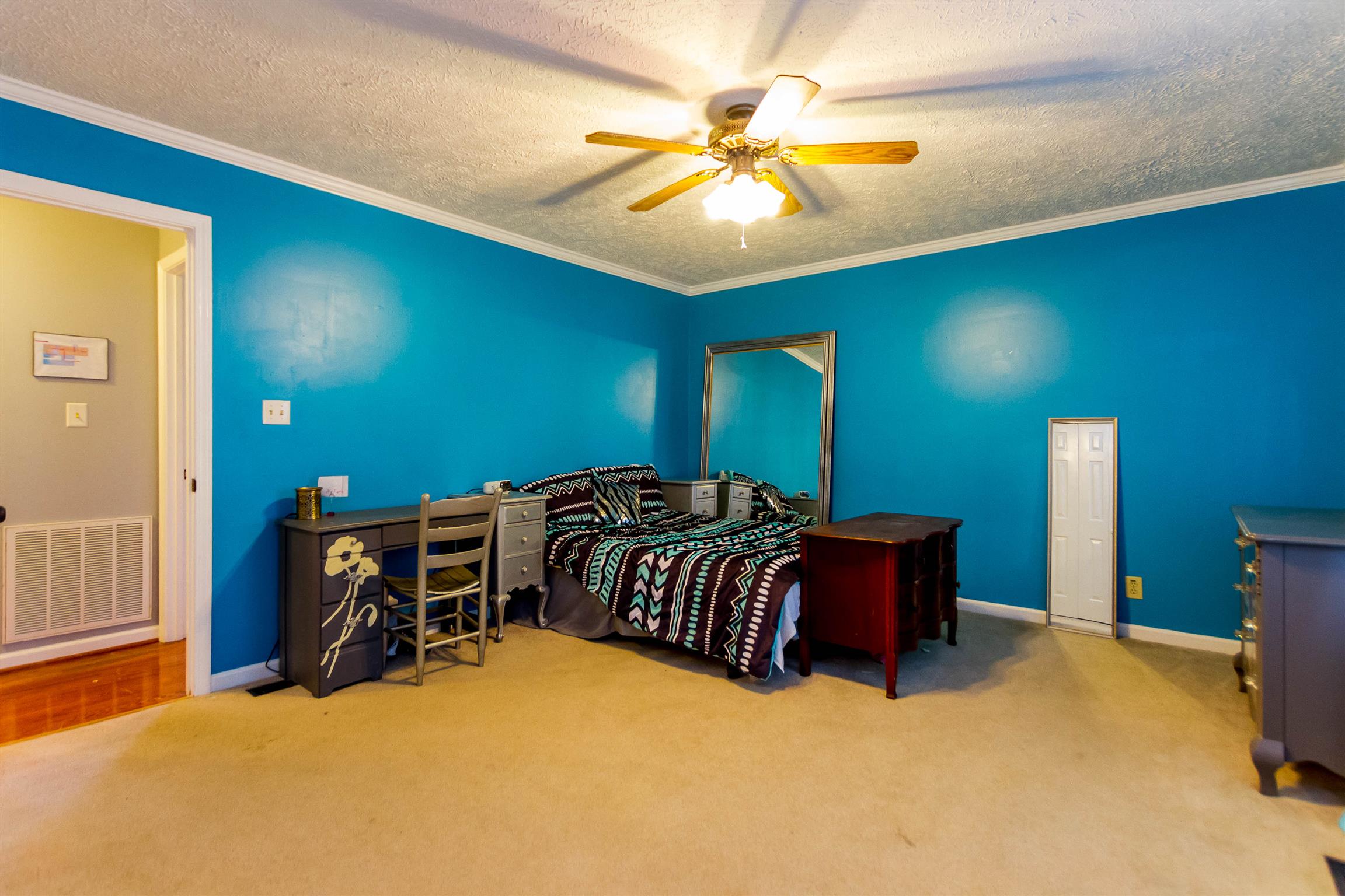 1941 Bradbury Road Adams, TN 37010 - Photo 7 of 30 a bedroom with a bed and a chandelier