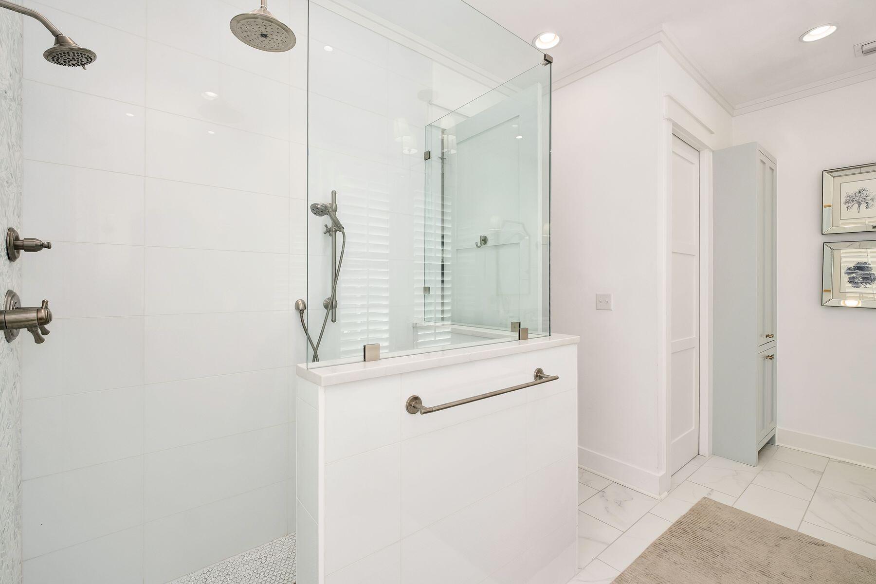 13 Madaket Way Watersound, FL 32461 - Photo 24 of 62 a bathroom with a shower sink and mirror