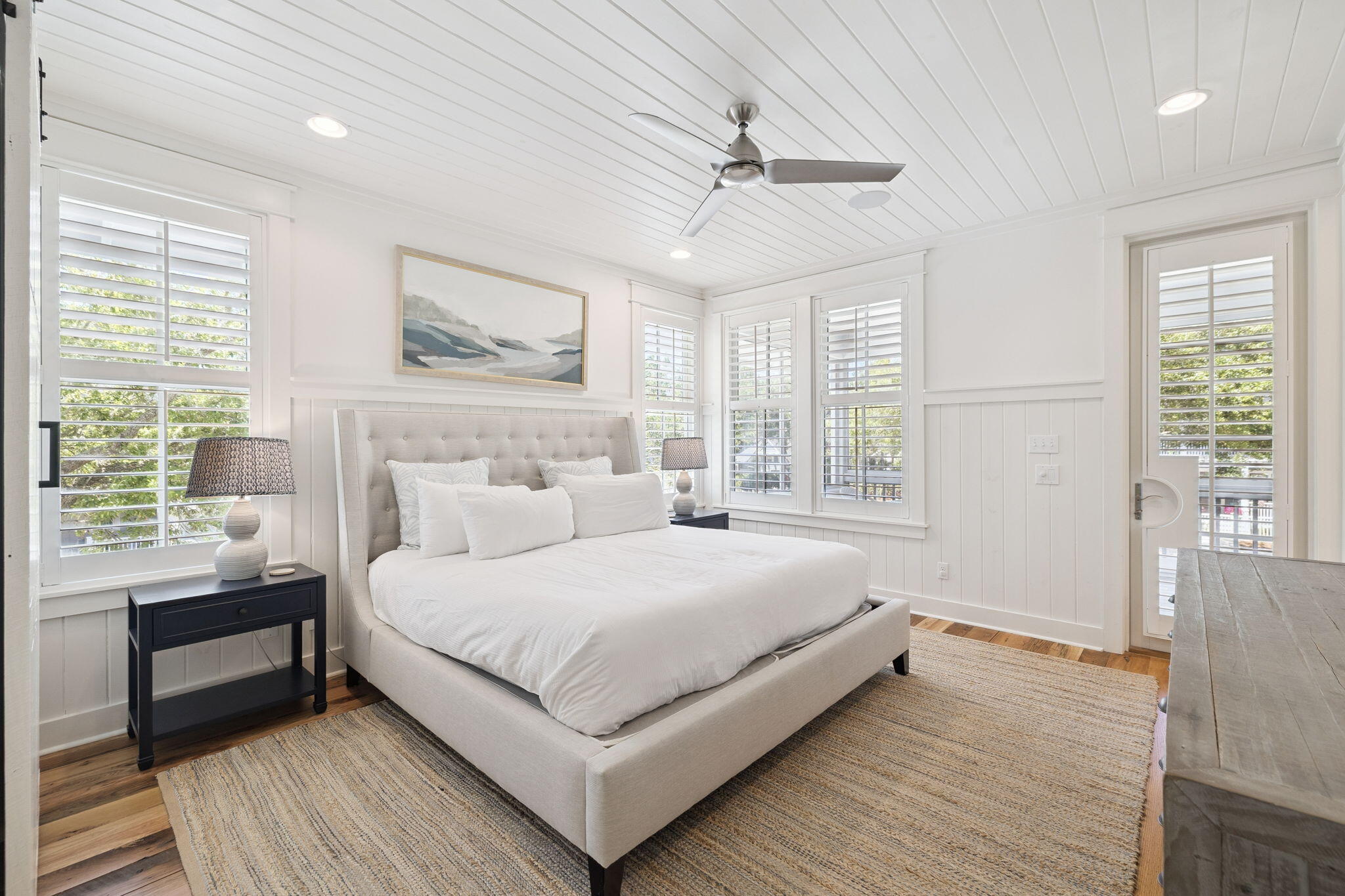 13 Madaket Way Watersound, FL 32461 - Photo 27 of 62 a bedroom with a large bed wooden floor and window
