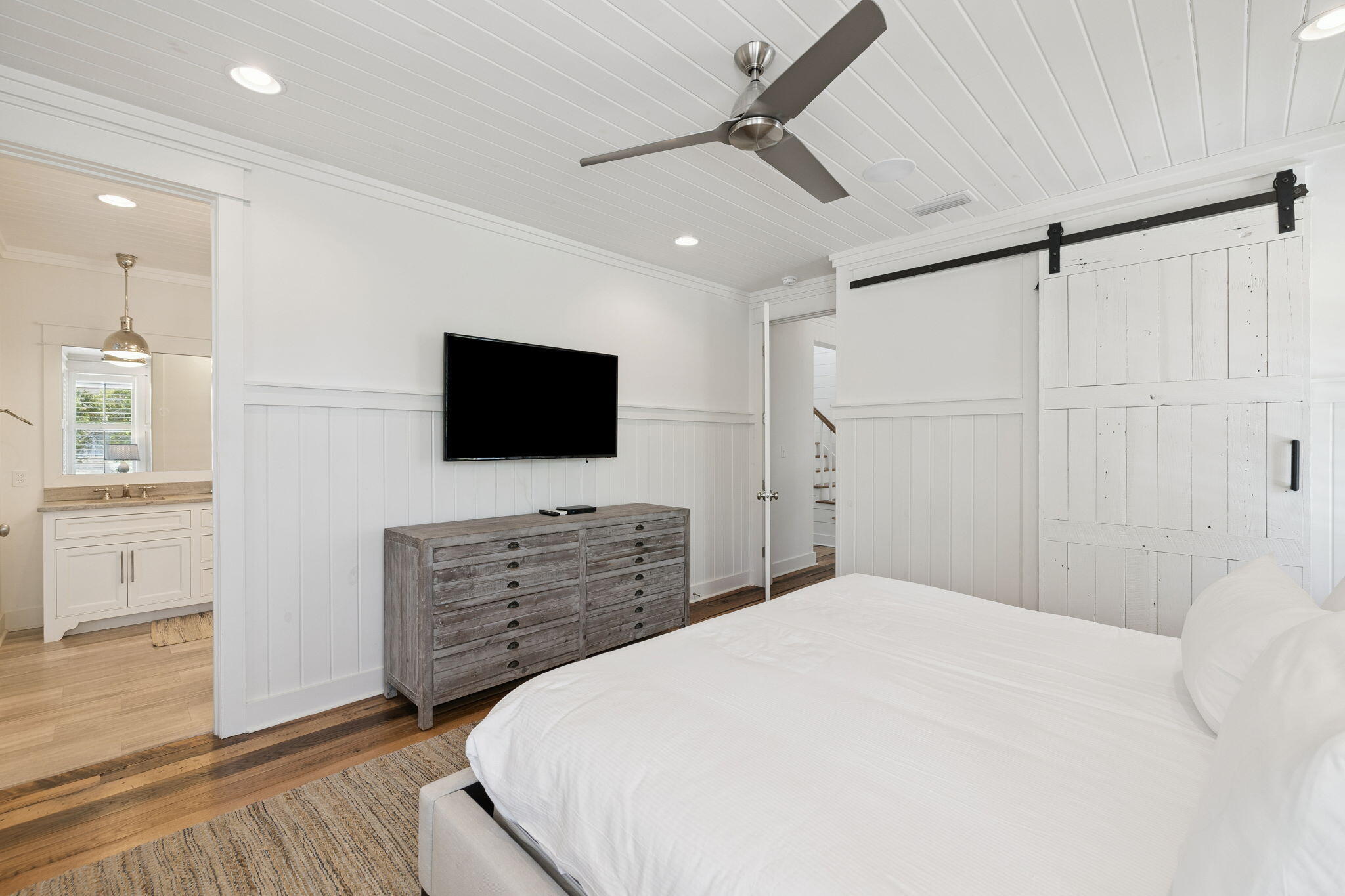 13 Madaket Way Watersound, FL 32461 - Photo 29 of 62 a bedroom with a bed and a flat screen tv