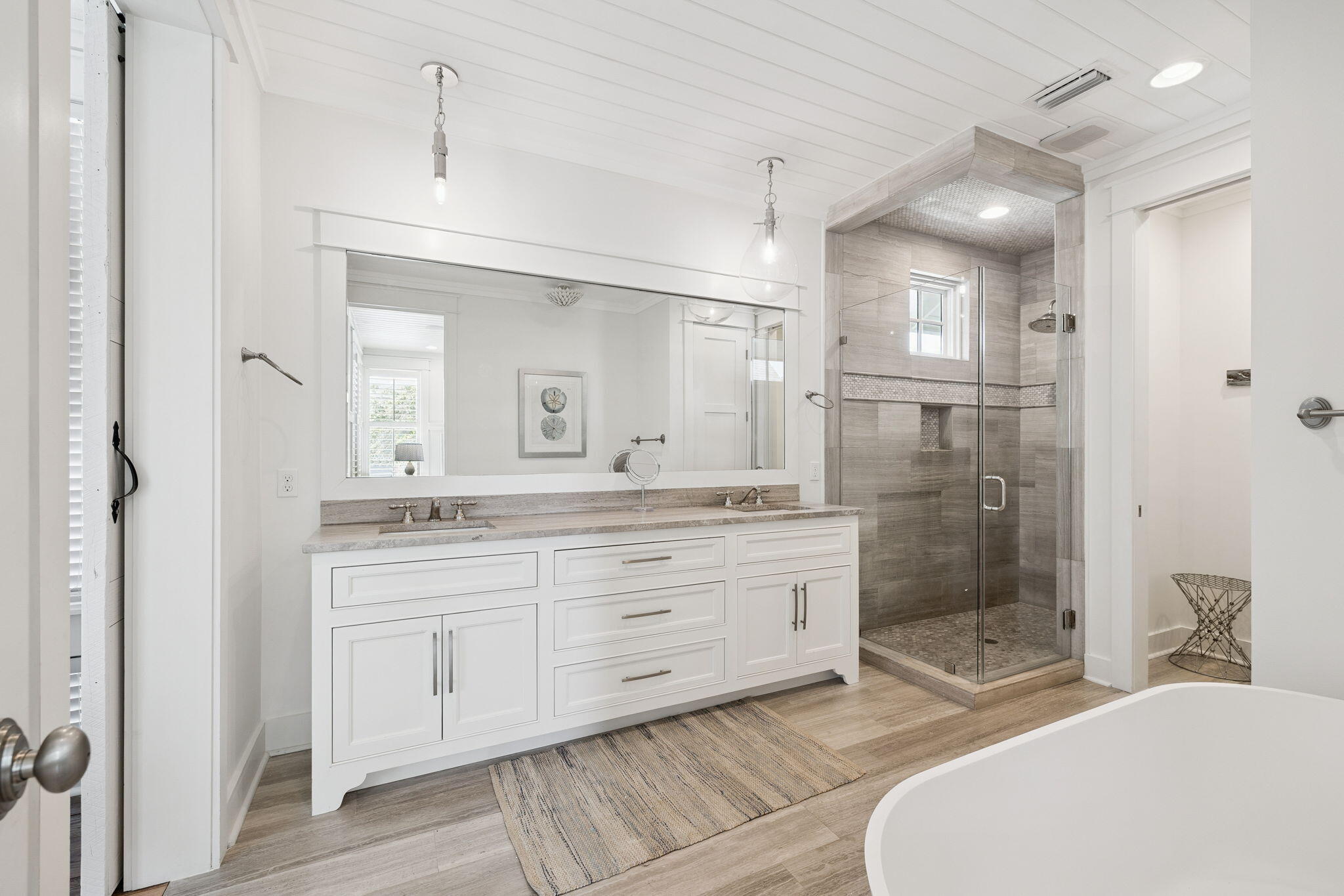 13 Madaket Way Watersound, FL 32461 - Photo 30 of 62 a spacious bathroom with a shower a sink and a mirror