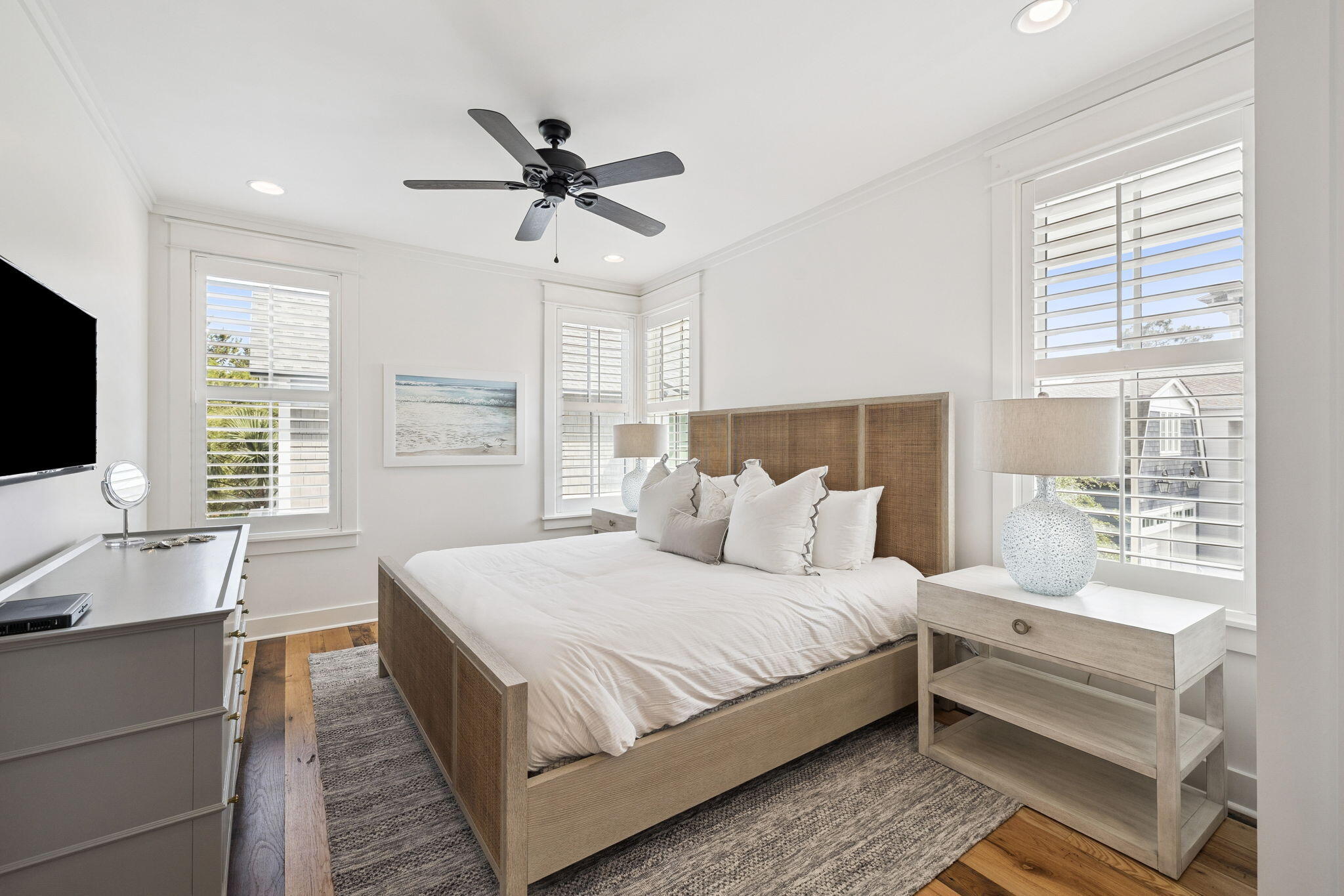 13 Madaket Way Watersound, FL 32461 - Photo 32 of 62 a bedroom with a large bed and a flat screen tv