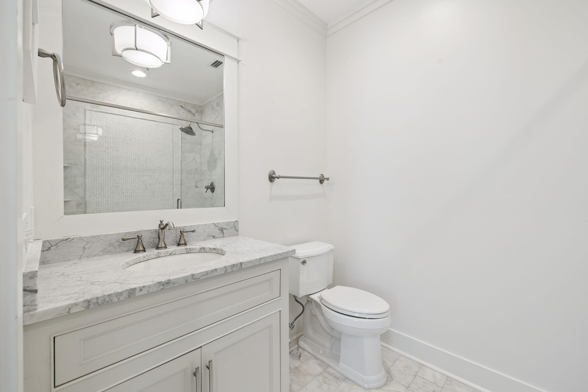13 Madaket Way Watersound, FL 32461 - Photo 33 of 62 a bathroom with a granite countertop toilet a sink and a mirror