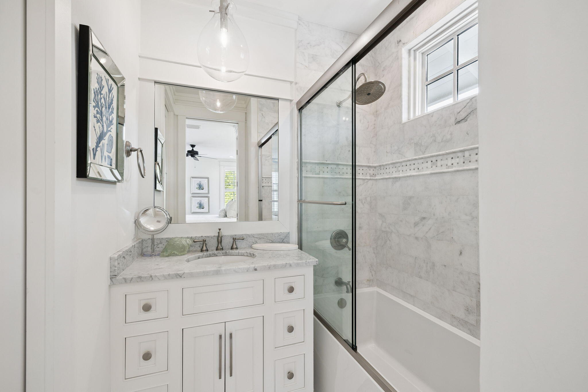 13 Madaket Way Watersound, FL 32461 - Photo 36 of 62 a bathroom with a granite countertop sink a mirror a shower and a bathtub
