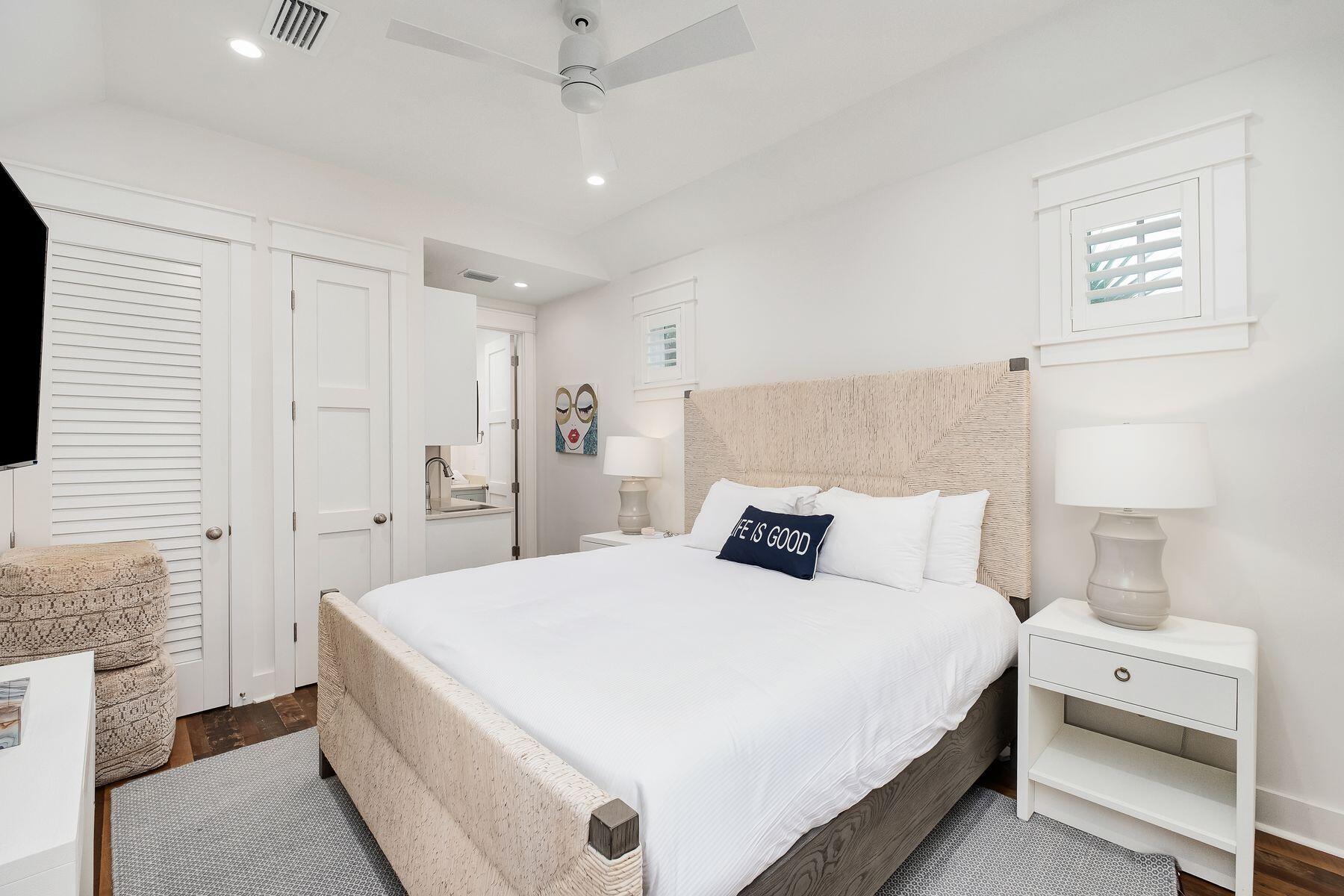 13 Madaket Way Watersound, FL 32461 - Photo 45 of 62 a bedroom with a bed and a flat tv screen