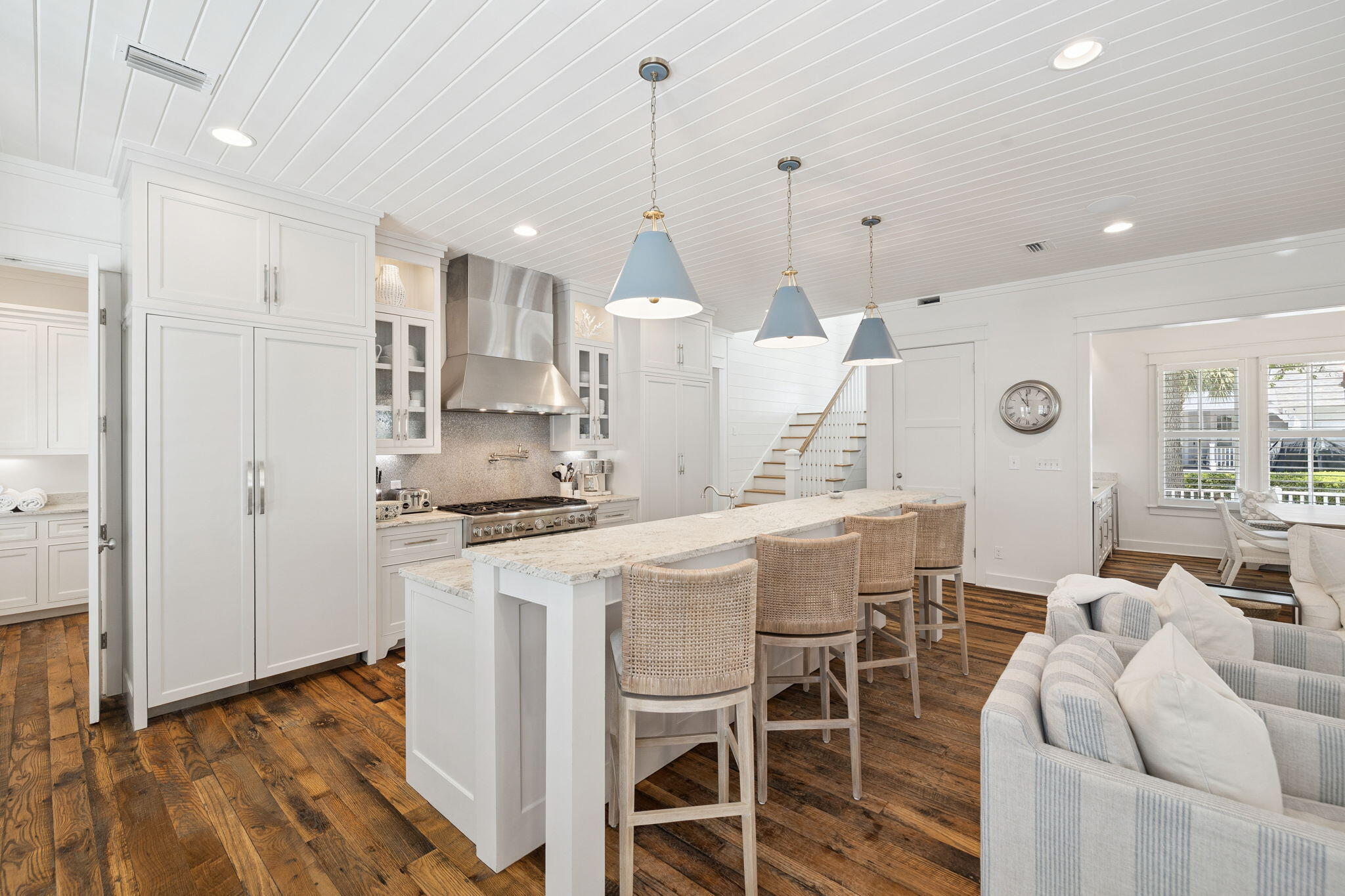 13 Madaket Way Watersound, FL 32461 - Photo 5 of 62 a kitchen with stainless steel appliances kitchen island granite countertop a dining table chairs and white cabinets