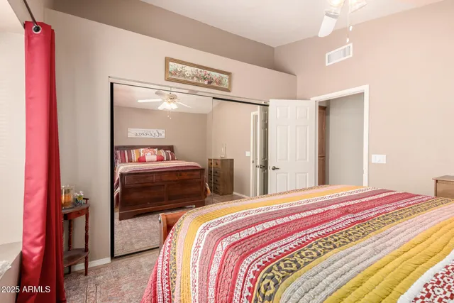 a bedroom with a bed and a closet