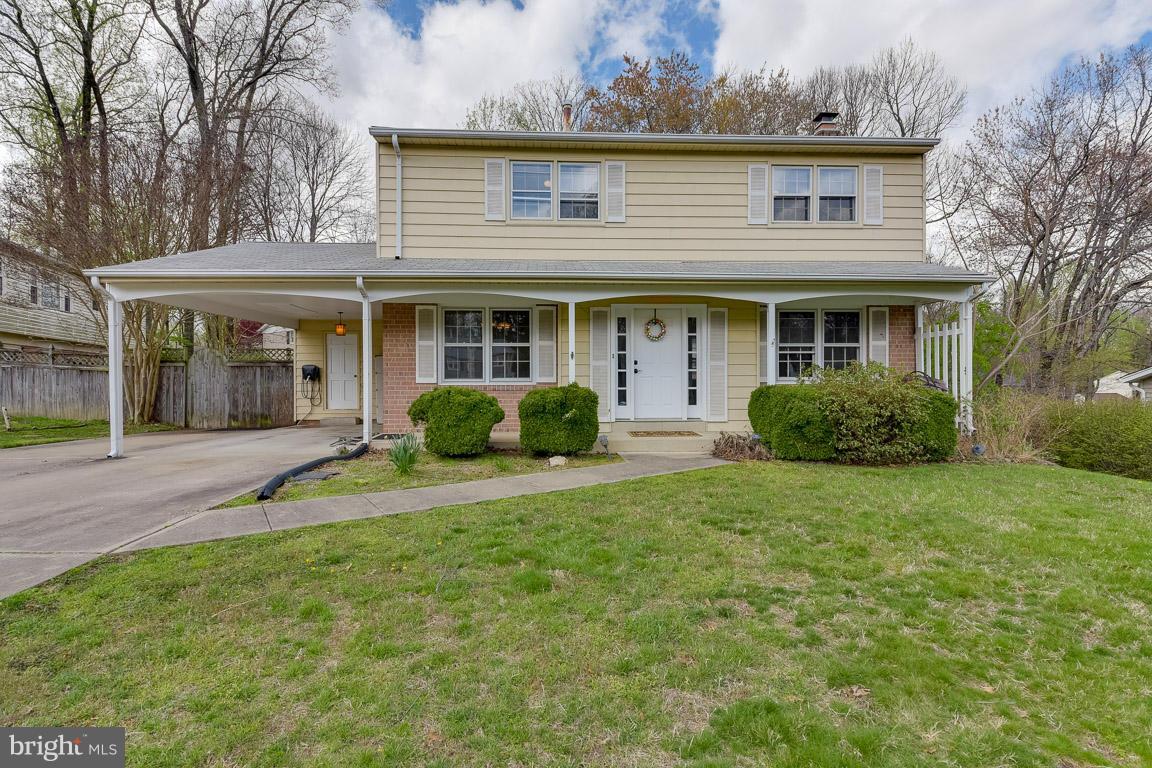 6716 Huntsman Boulevard Springfield, VA 22152 - Photo 1 of 30 front view of a house with a yard