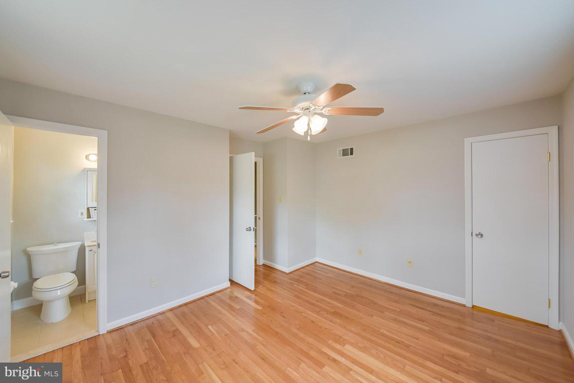 6716 Huntsman Boulevard Springfield, VA 22152 - Photo 14 of 30 a view of a room with wooden floor and window