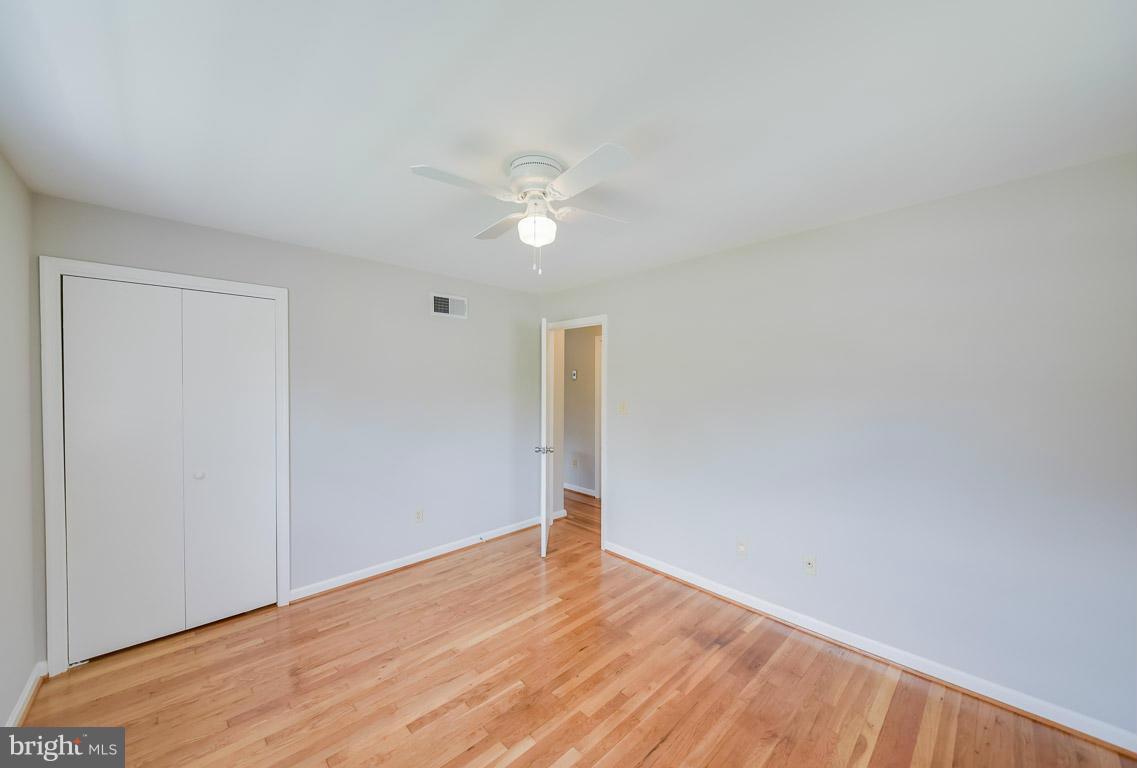 6716 Huntsman Boulevard Springfield, VA 22152 - Photo 18 of 30 a view of empty room with wooden floor