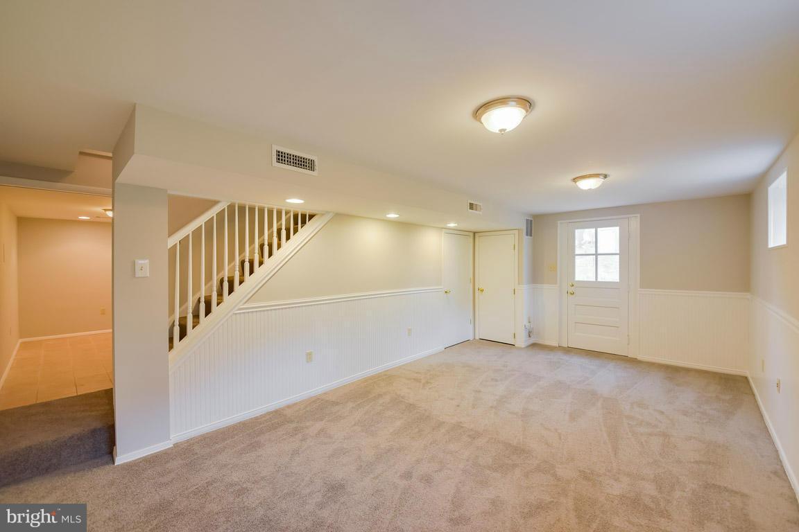 6716 Huntsman Boulevard Springfield, VA 22152 - Photo 21 of 30 a view of an empty room with a window