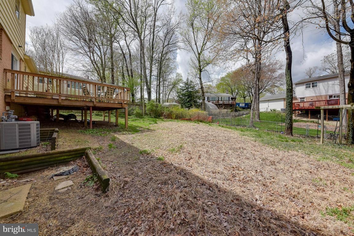 6716 Huntsman Boulevard Springfield, VA 22152 - Photo 25 of 30 a view of a house with a yard