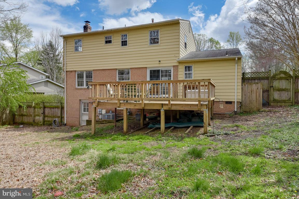 6716 Huntsman Boulevard Springfield, VA 22152 - Photo 29 of 30 a view of a house with a yard and sitting area