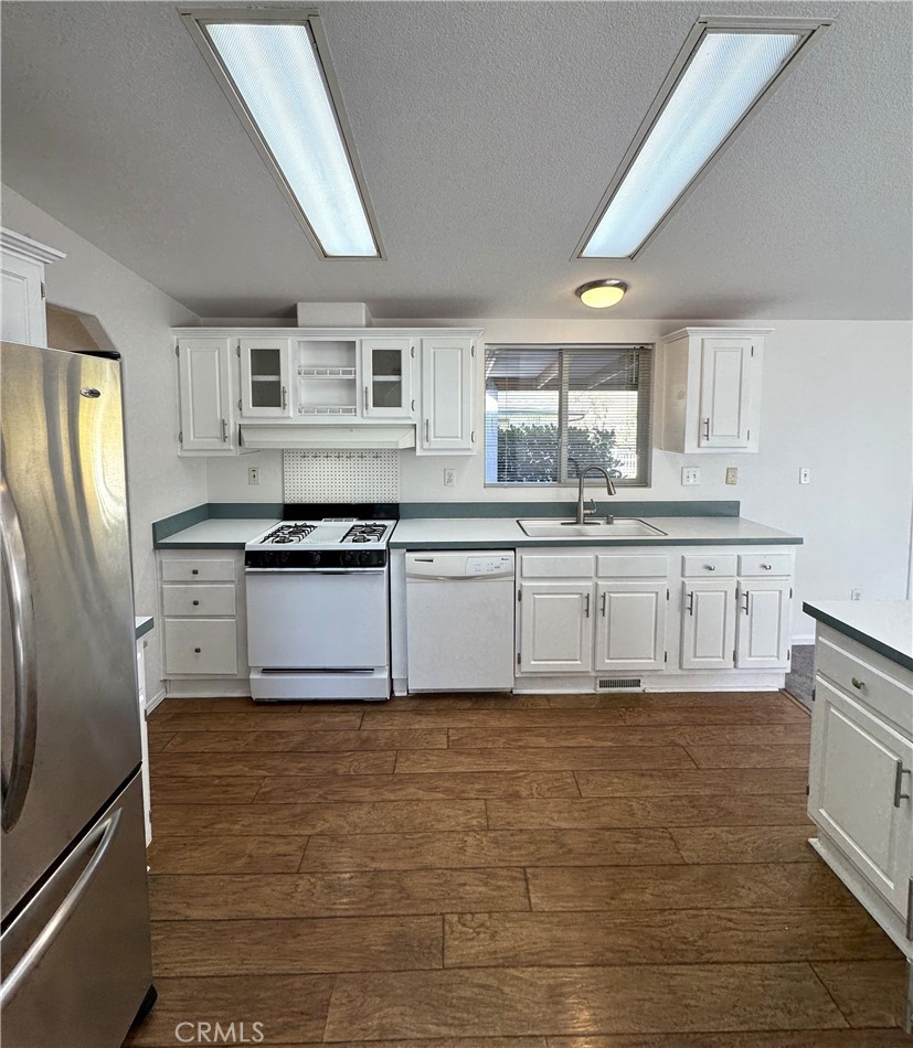 4190 Hackney Way Paso Robles, CA 93446 - Photo 13 of 40 a kitchen with granite countertop a sink stainless steel appliances and cabinets