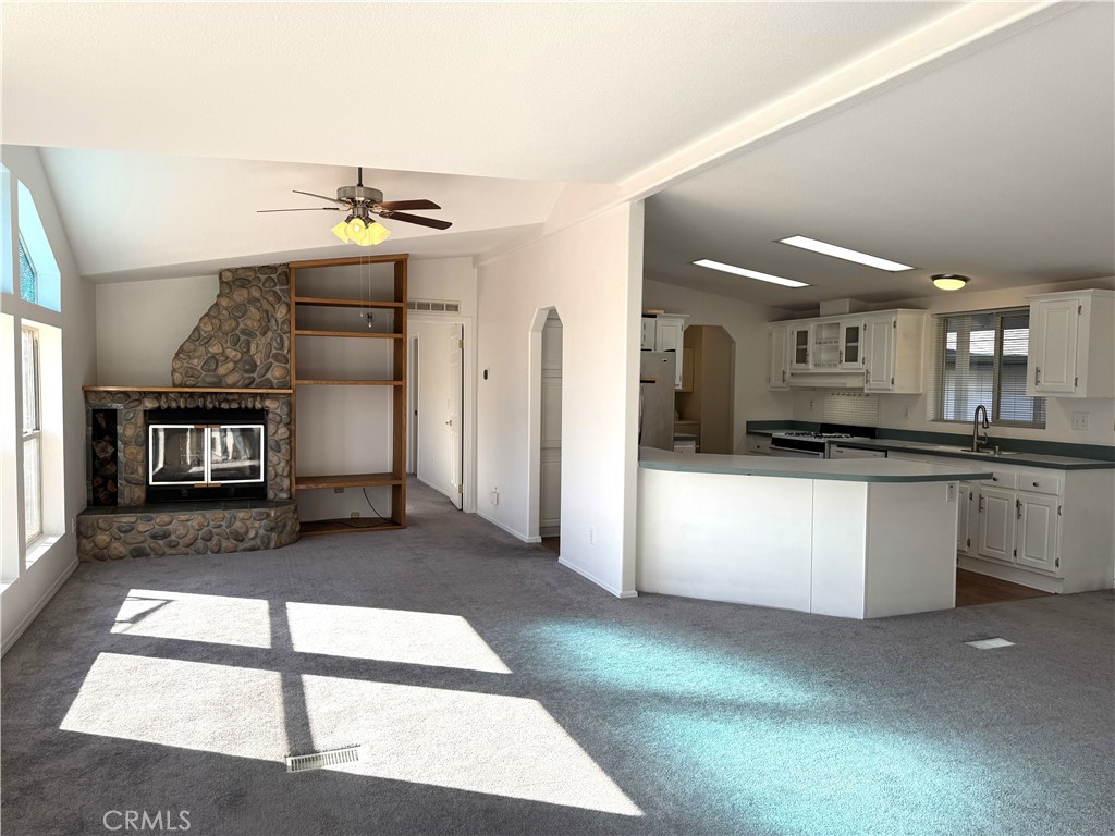4190 Hackney Way Paso Robles, CA 93446 - Photo 15 of 40 a view of living room with kitchen island furniture and a fireplace