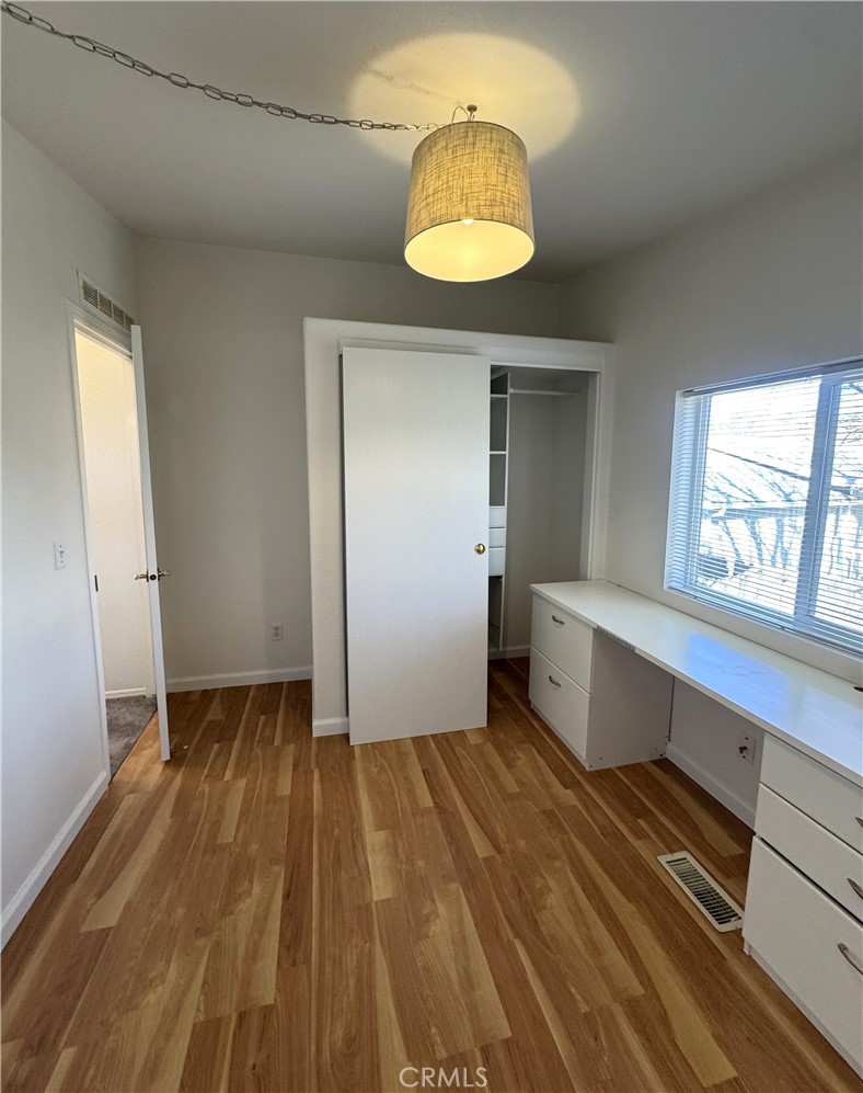 4190 Hackney Way Paso Robles, CA 93446 - Photo 28 of 40 a view of a room with wooden floor and window
