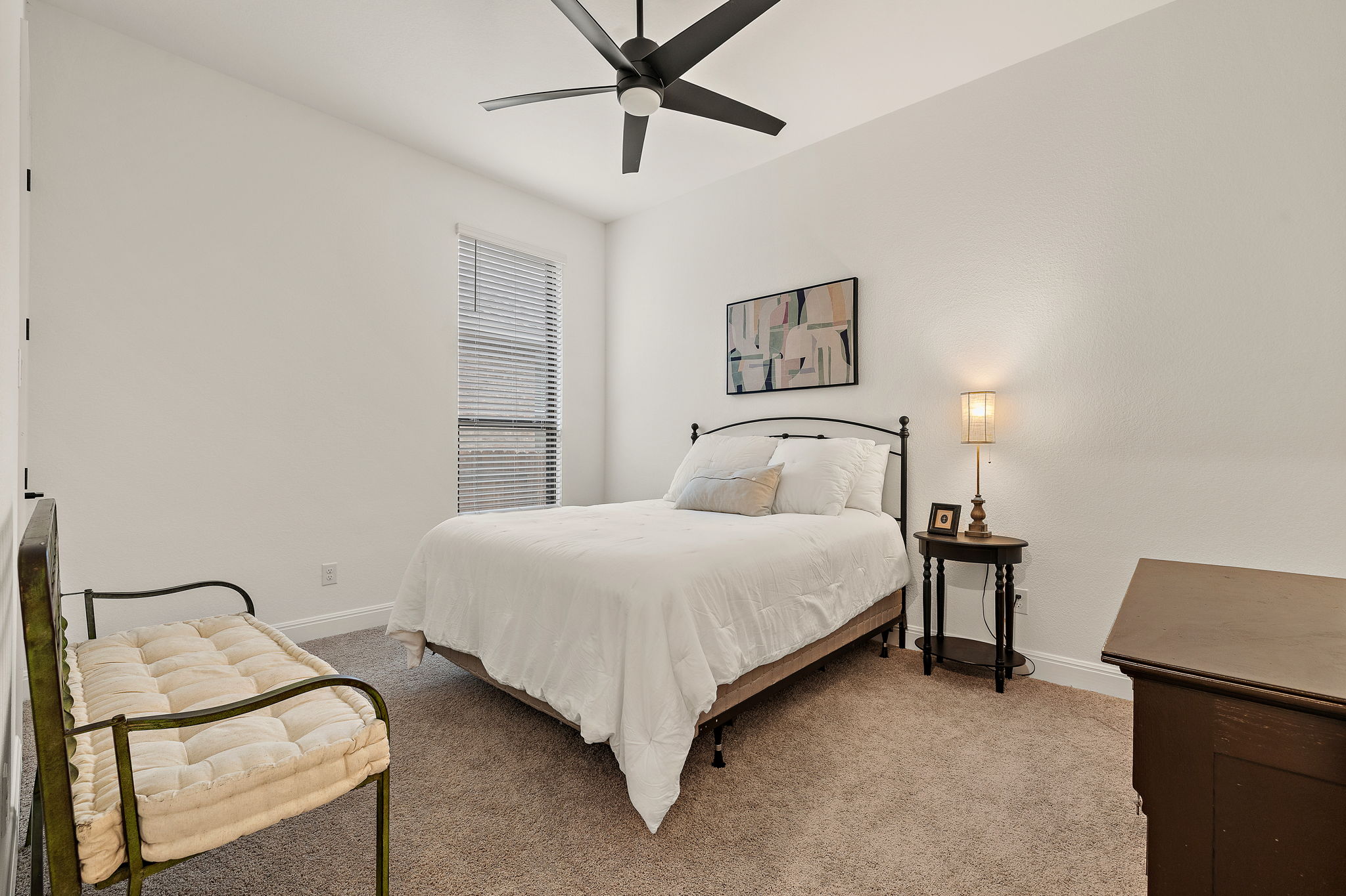181 Constitution Way Kyle, TX 78640 - Photo 25 of 32 a bedroom with a bed and window