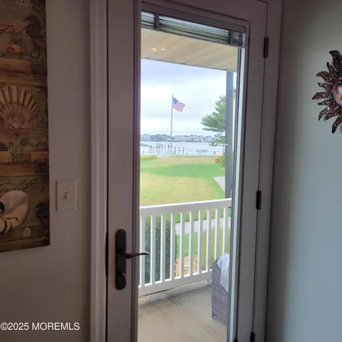a view of a glass door and a window