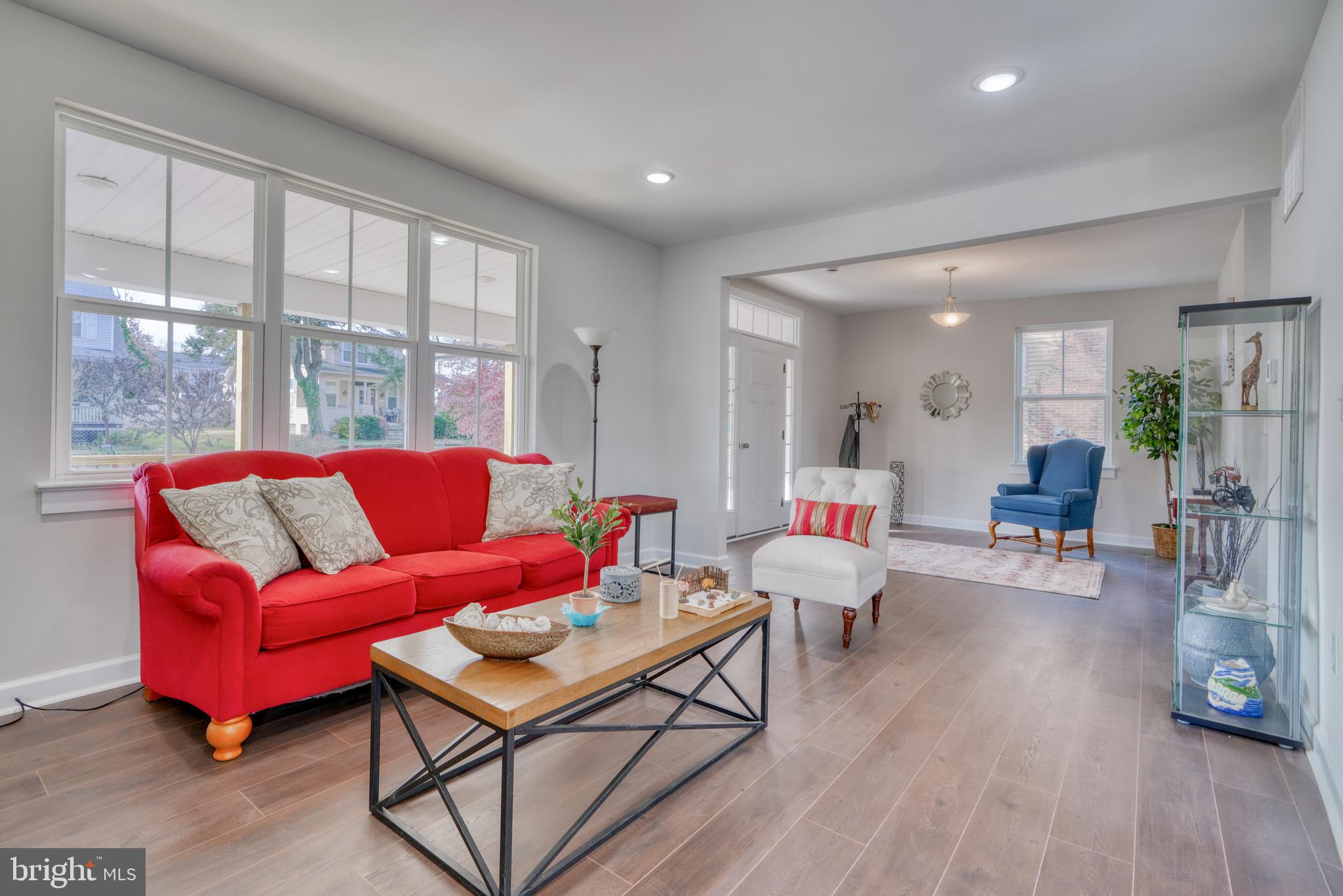 231 Mallow Hill Road Baltimore, MD 21229 - Photo 11 of 48 a living room with furniture and wooden floor