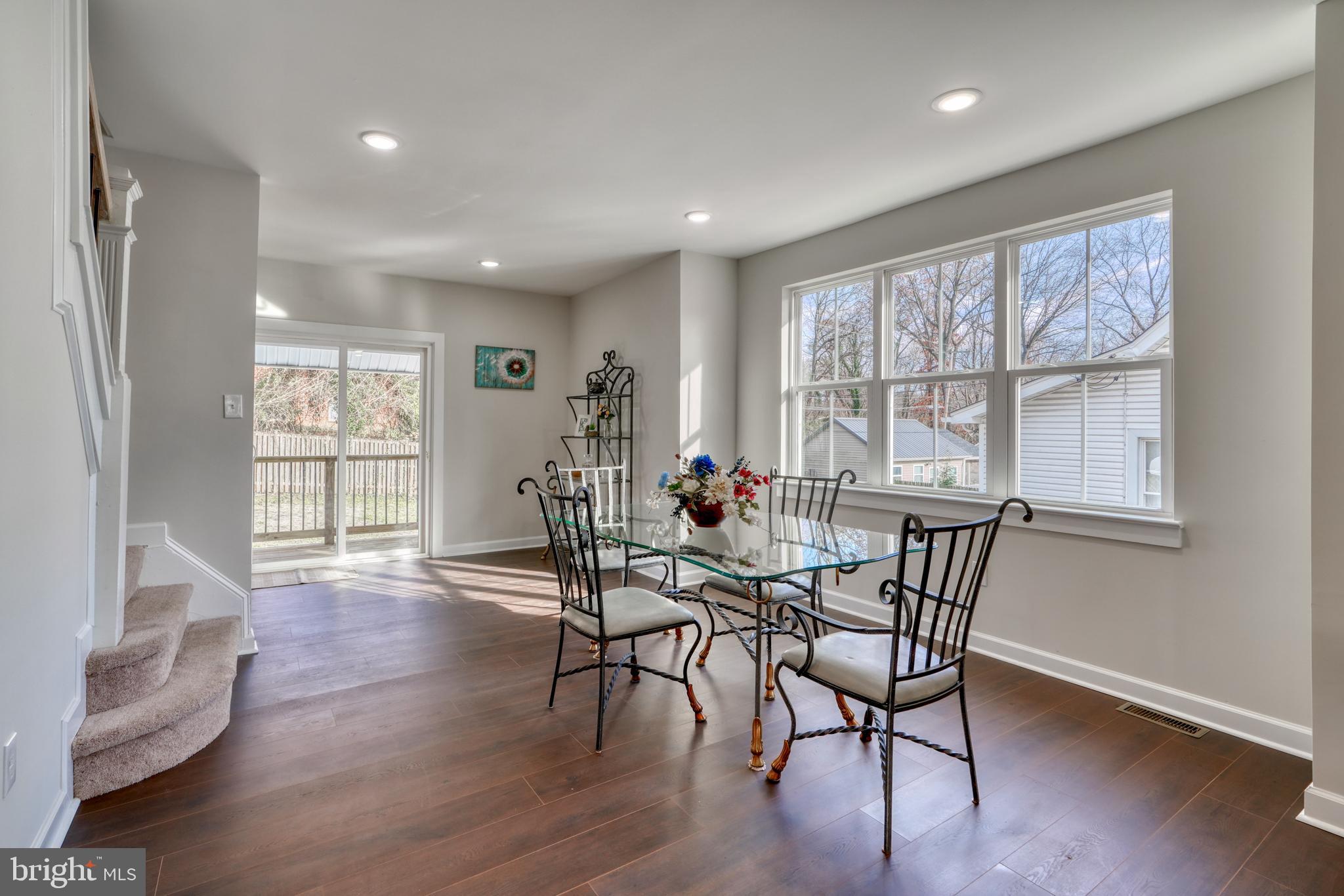231 Mallow Hill Road Baltimore, MD 21229 - Photo 13 of 48 a view of a dining room with furniture and wooden floor