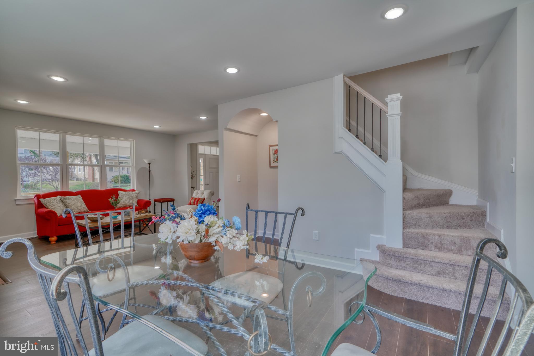 231 Mallow Hill Road Baltimore, MD 21229 - Photo 14 of 48 a living room with furniture kitchen view and a dining table
