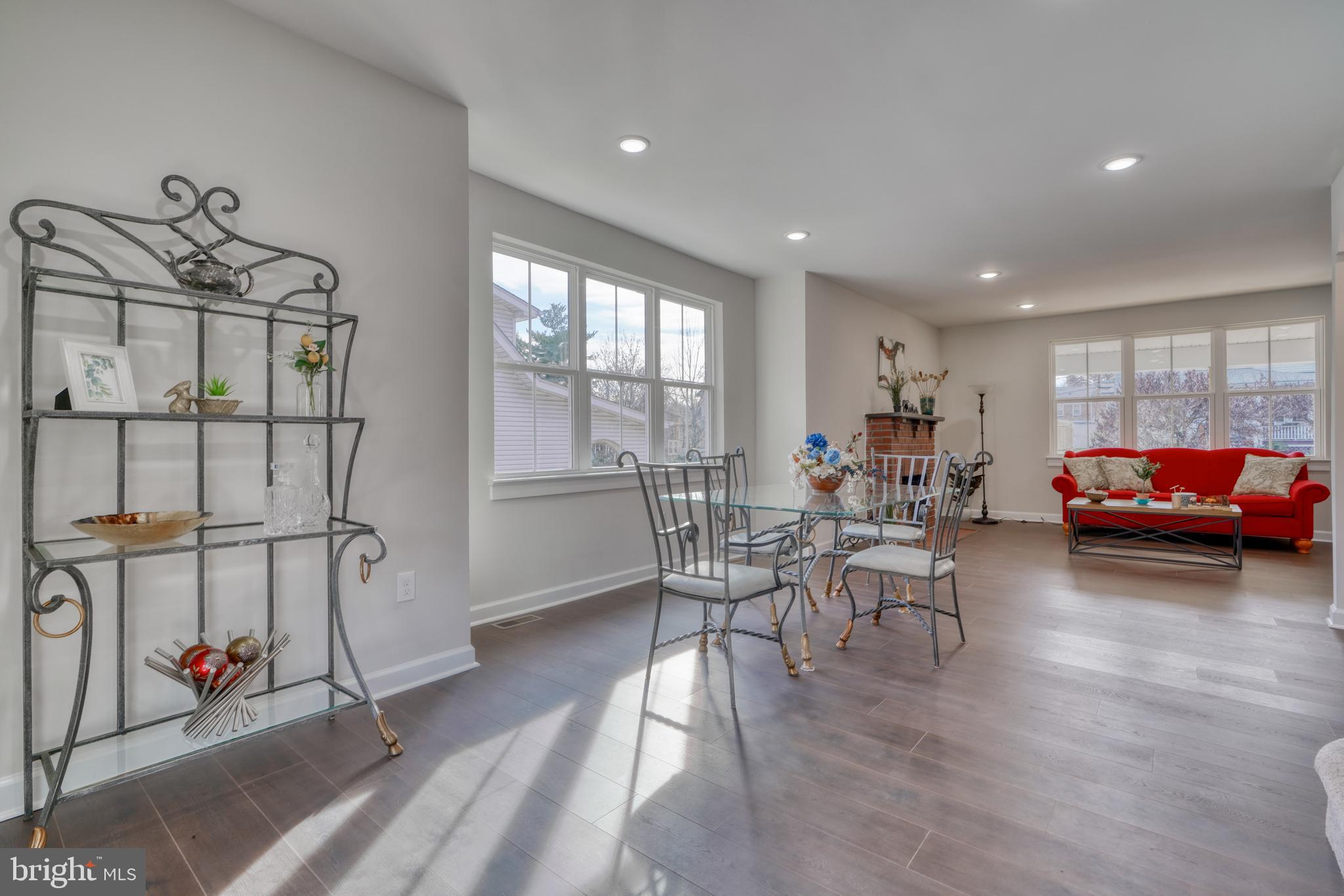 231 Mallow Hill Road Baltimore, MD 21229 - Photo 16 of 48 a living room with furniture a window and gym equipment
