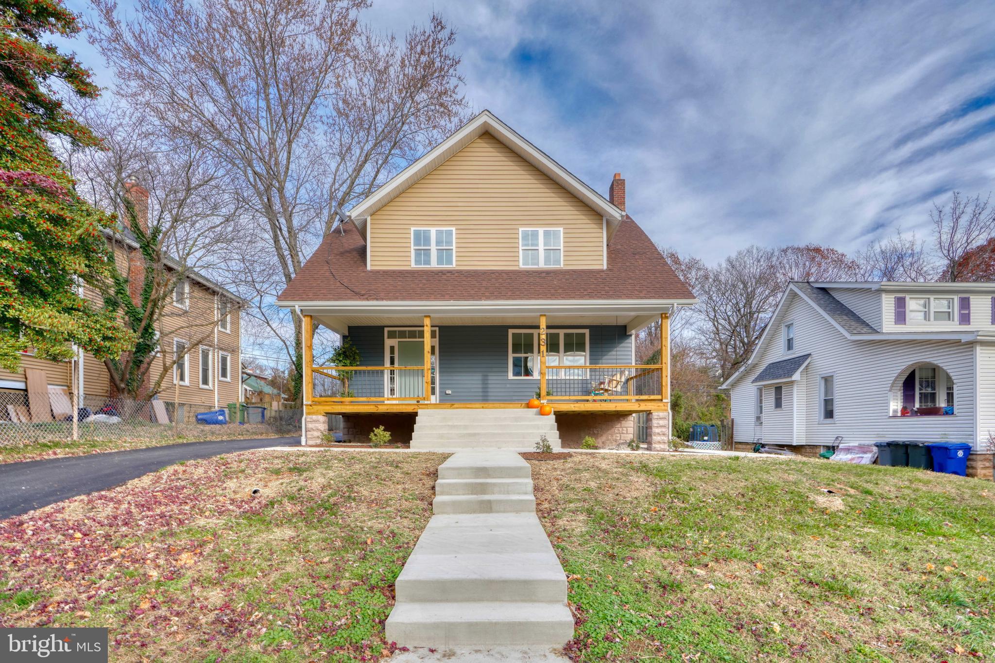 231 Mallow Hill Road Baltimore, MD 21229 - Photo 2 of 48 a front view of a house with a yard