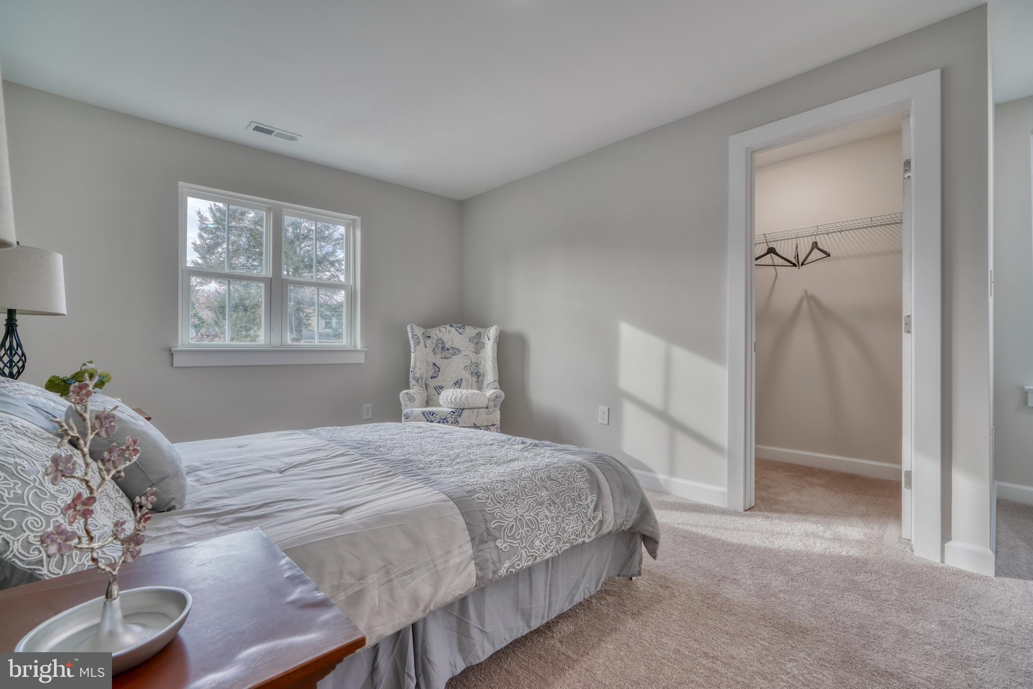 231 Mallow Hill Road Baltimore, MD 21229 - Photo 24 of 48 a bedroom with a bed and a window