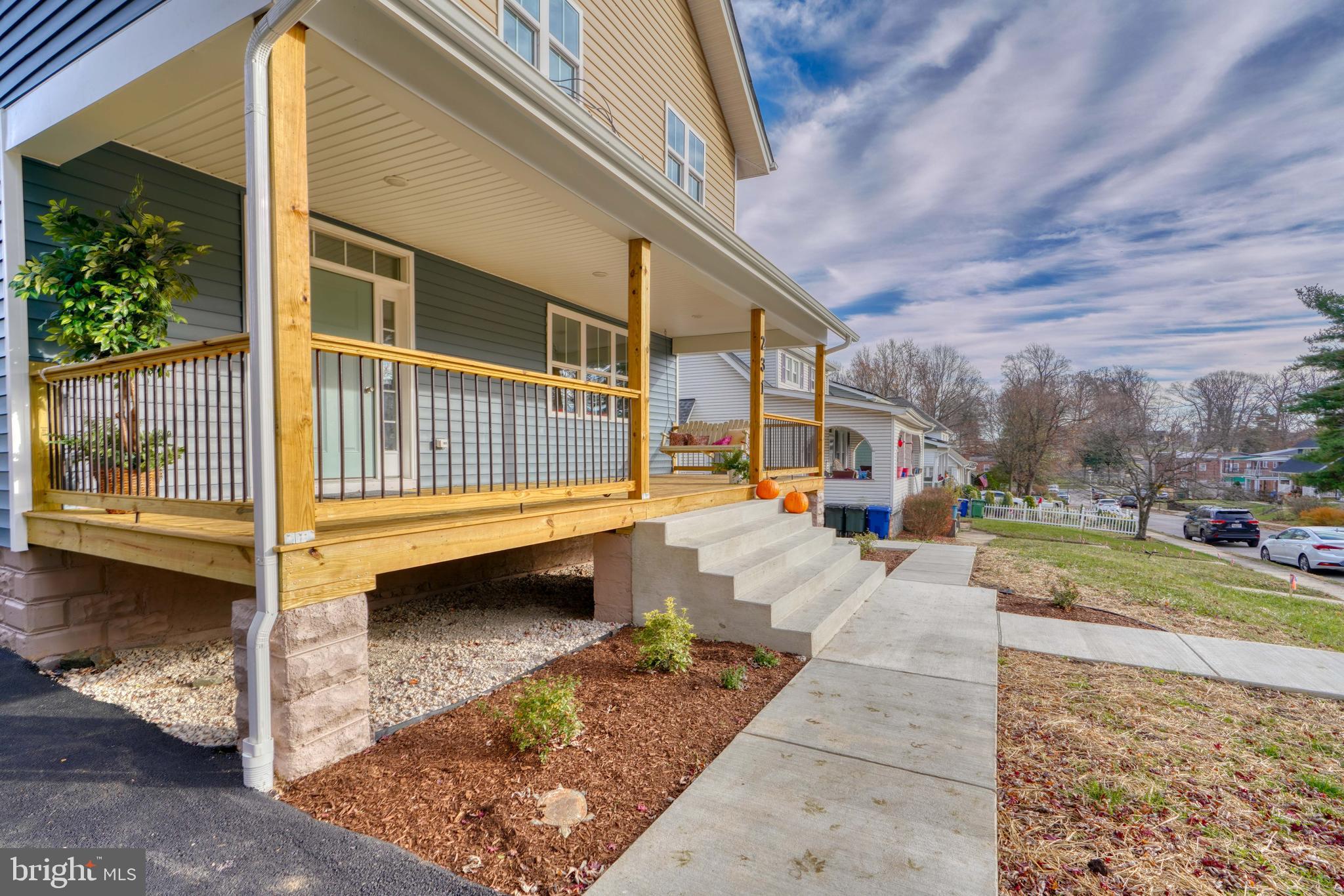 231 Mallow Hill Road Baltimore, MD 21229 - Photo 3 of 48 a view of a porch with furniture and a yard