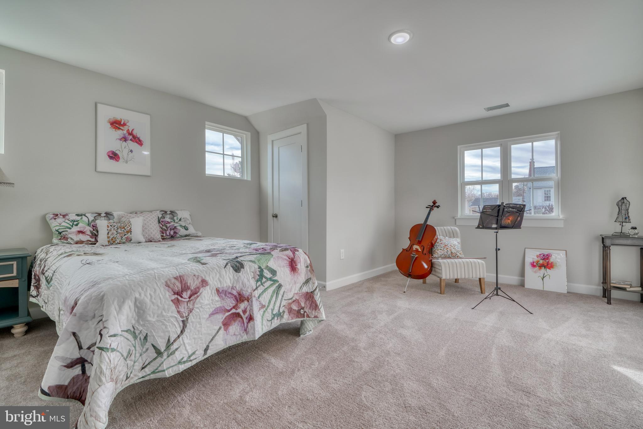 231 Mallow Hill Road Baltimore, MD 21229 - Photo 31 of 48 a bedroom with bed and a large window