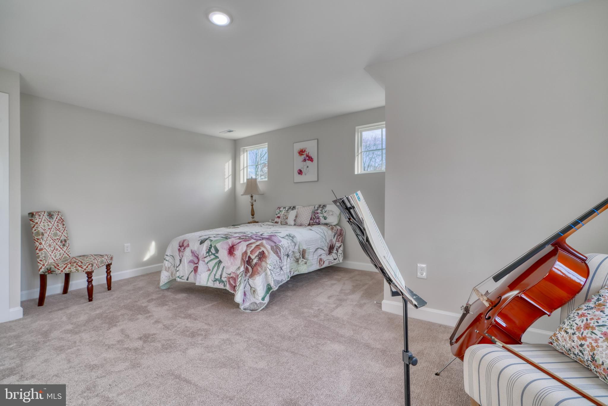 231 Mallow Hill Road Baltimore, MD 21229 - Photo 32 of 48 a bedroom with a bed and a couch