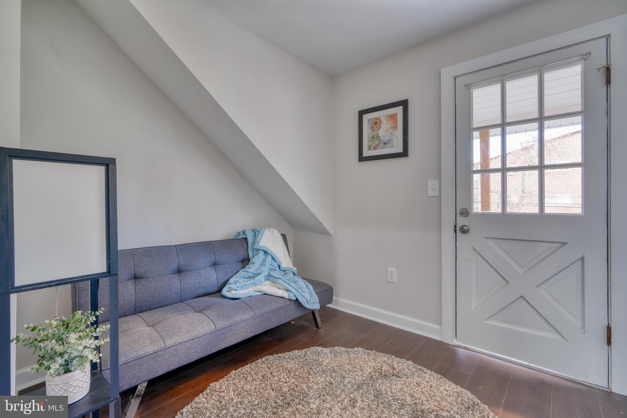 231 Mallow Hill Road Baltimore, MD 21229 - Photo 33 of 48 a living room with furniture and wooden floor