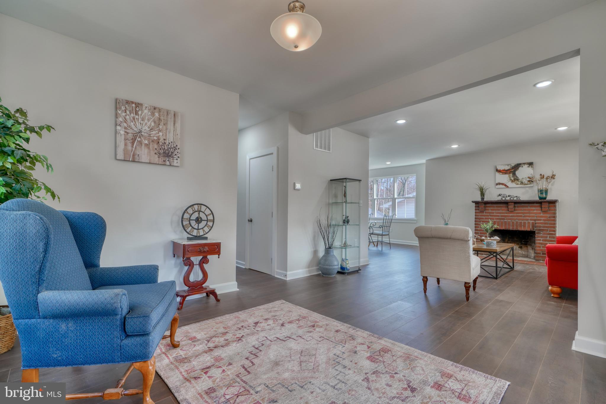 231 Mallow Hill Road Baltimore, MD 21229 - Photo 6 of 48 a living room with furniture and a wooden floor