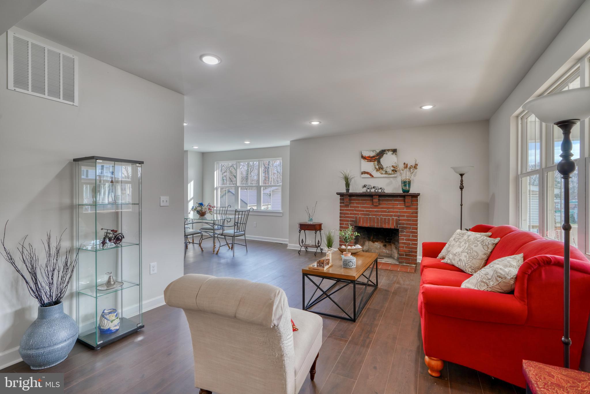 231 Mallow Hill Road Baltimore, MD 21229 - Photo 9 of 48 a living room with furniture and a fireplace