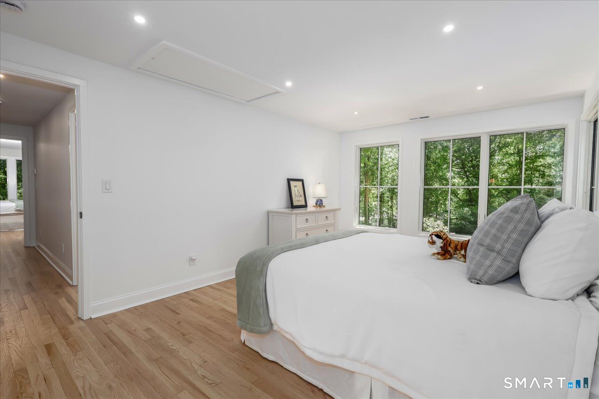 256 Wilton Road East Ridgefield, CT 06877 - Photo 21 of 40 a bed sitting in a spacious bedroom next to a window