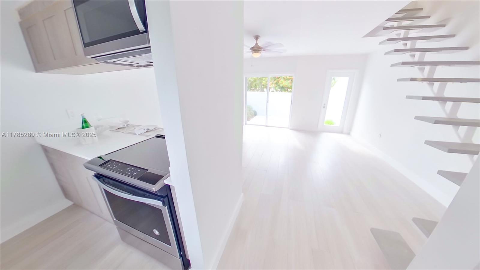 798 Crandon Boulevard, Unit 45B Key Biscayne, FL 33149 - Photo 5 of 22 a view of kitchen and utility room