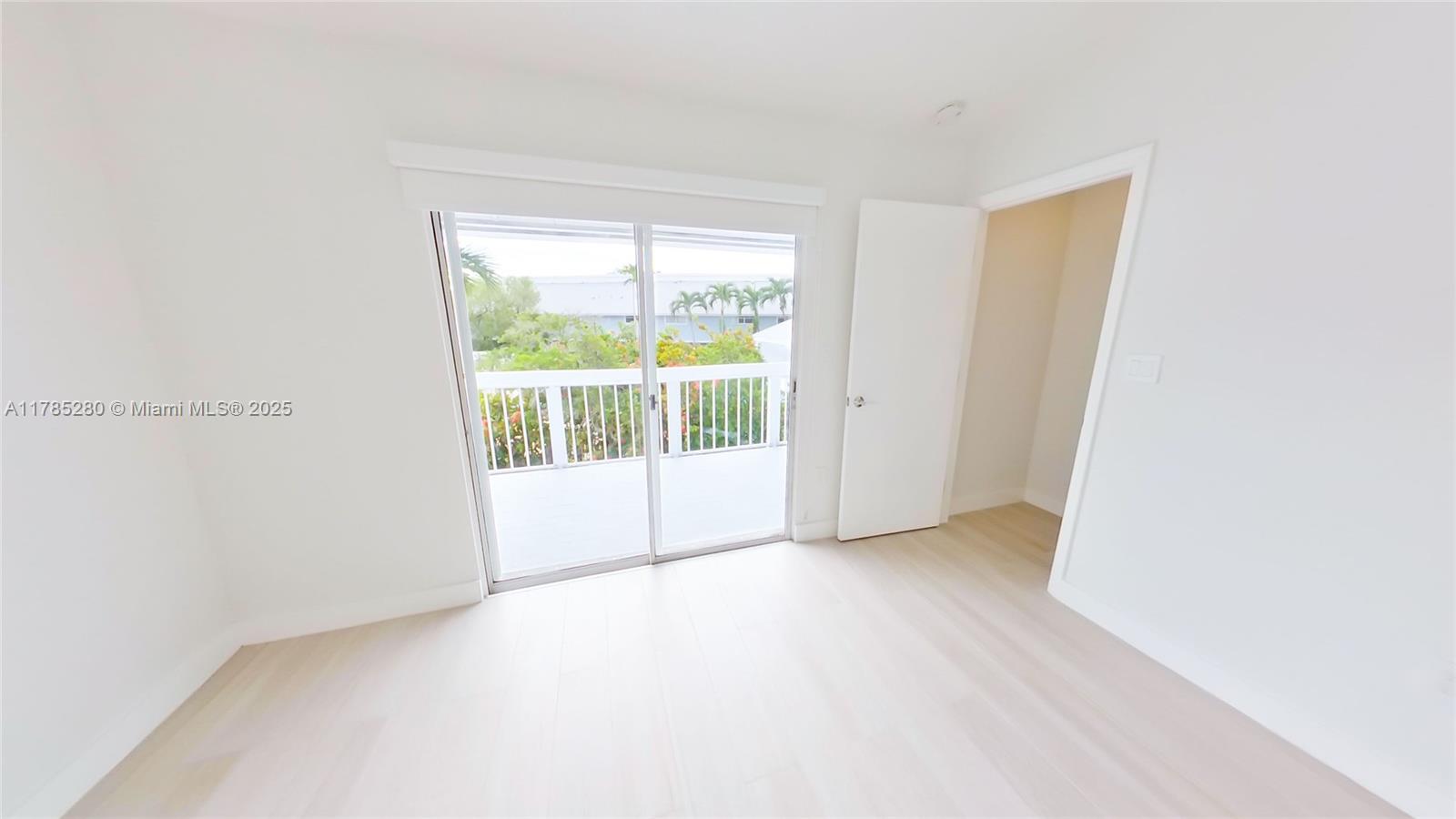 798 Crandon Boulevard, Unit 45B Key Biscayne, FL 33149 - Photo 9 of 22 a view of an empty room with a window