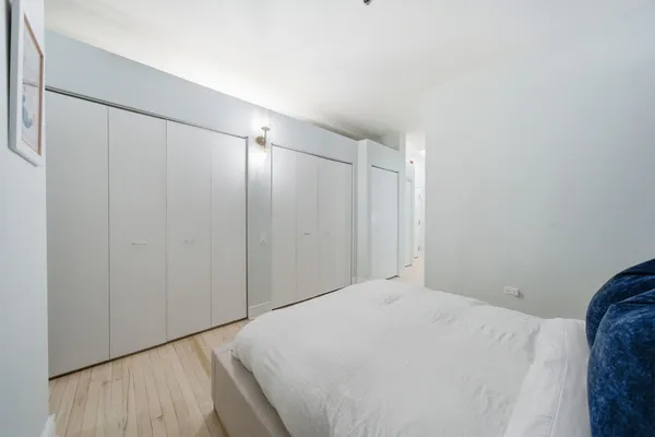 a bedroom with a bed and a shower