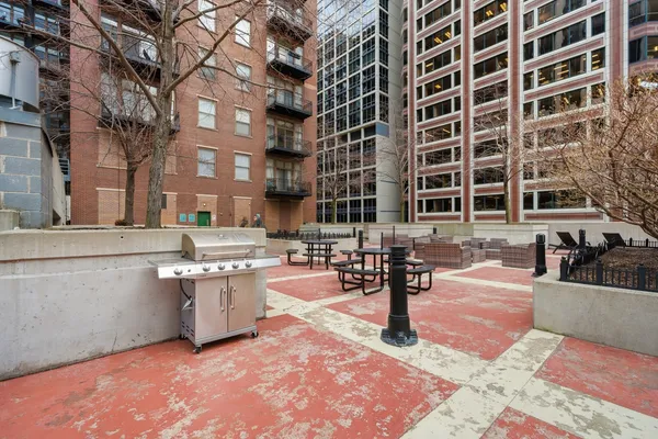 a view of a building with yard and sitting area