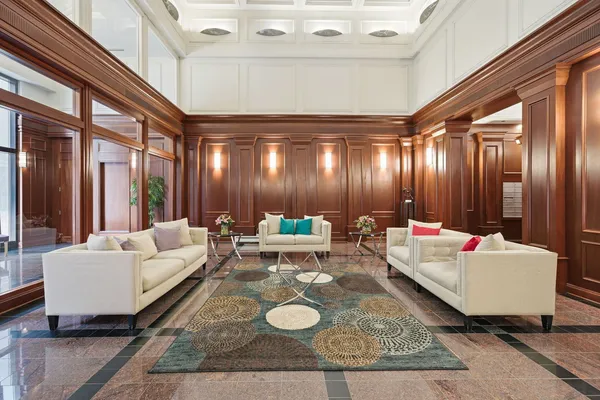 a living room with furniture and a large window