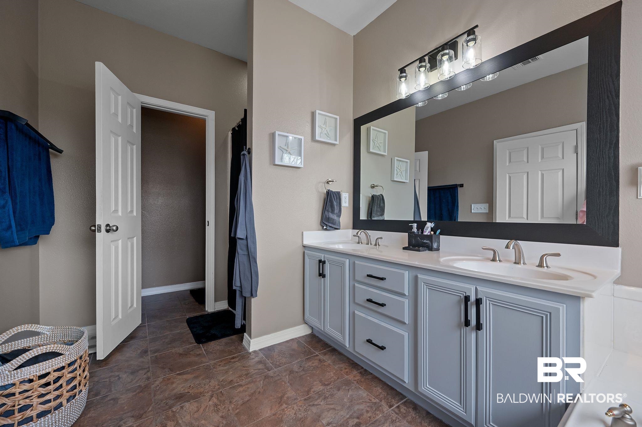 1287 Pembroke Way Foley, AL 36535 - Photo 24 of 39 Bathroom featuring double vanity and curtained shower