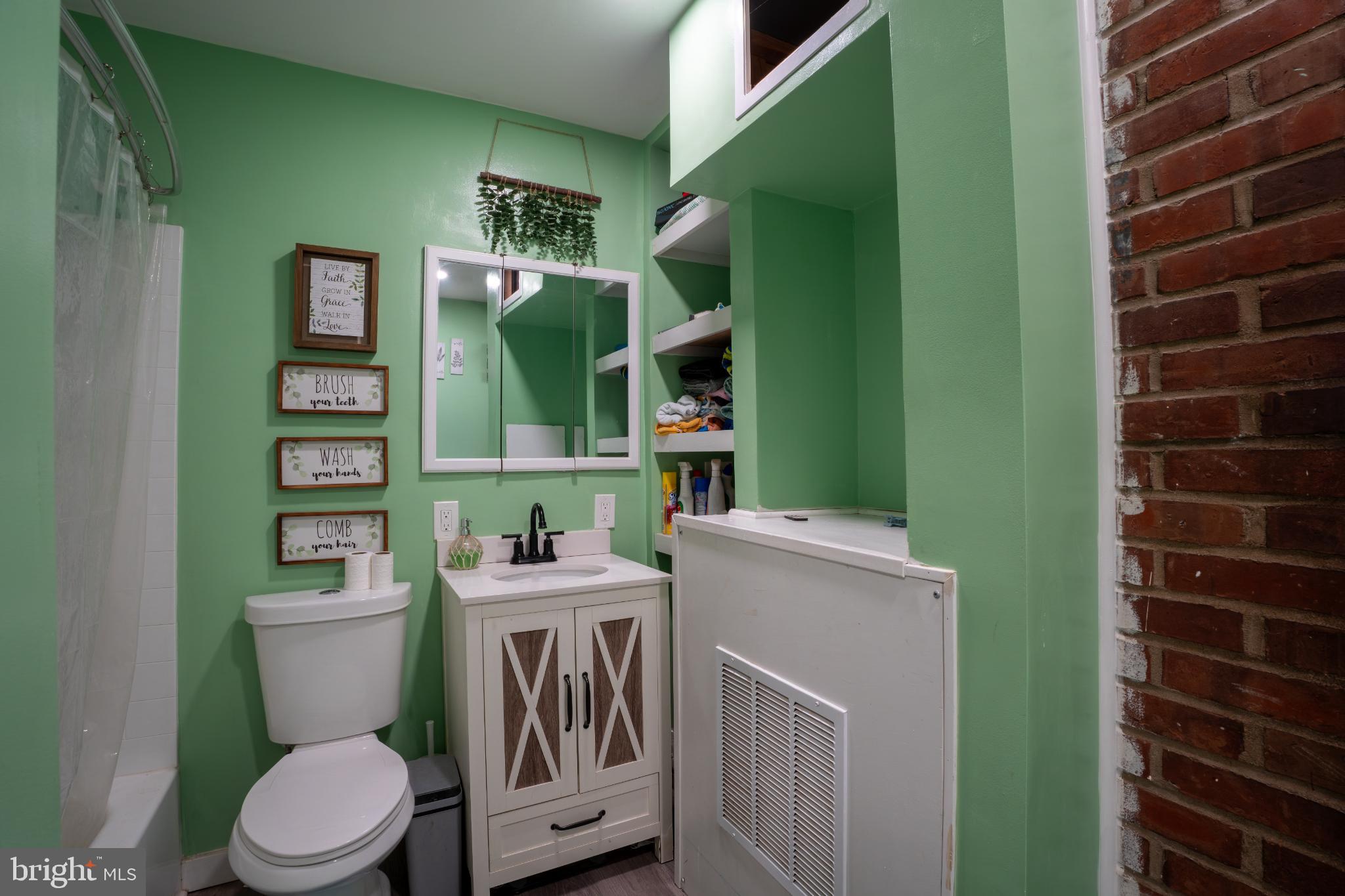 86 Wildflower Road Levittown, PA 19057 - Photo 5 of 17 Charming green bathroom with modern accents.