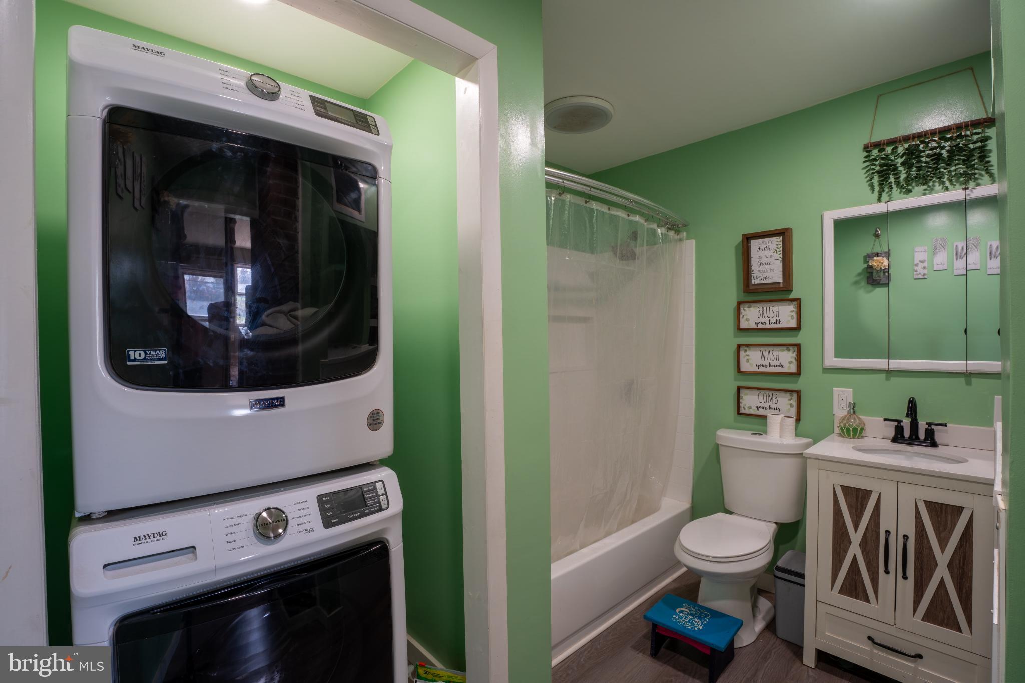 86 Wildflower Road Levittown, PA 19057 - Photo 6 of 17 Charming green-hued laundry nook.