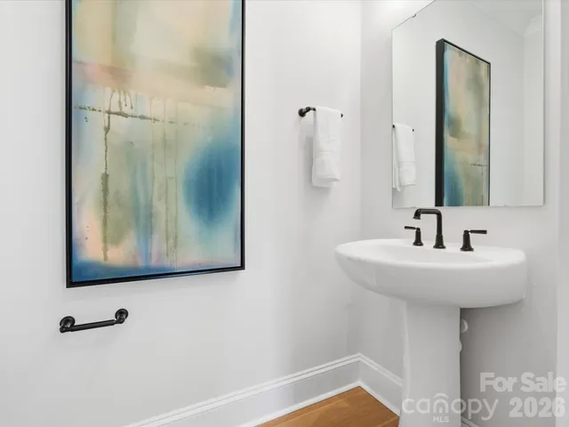 a bathroom with a sink and mirror