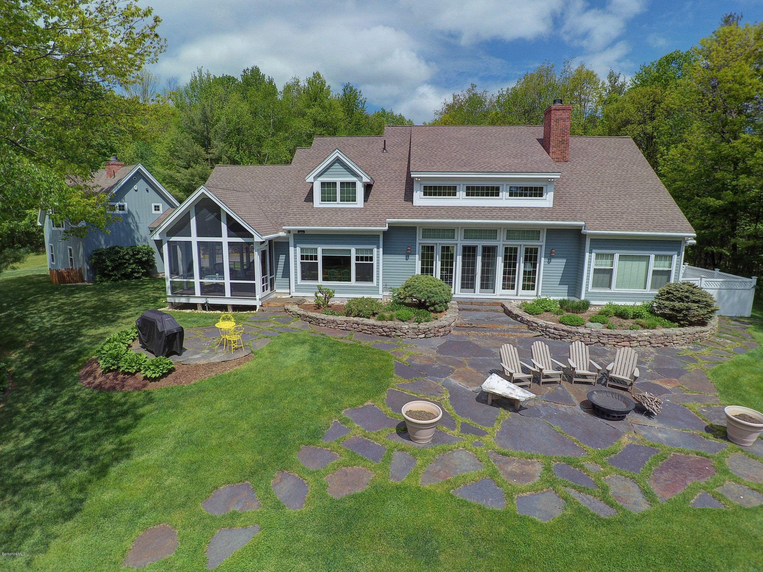 28 Austerlitz Road West Stockbridge, MA 01266 - Photo 2 of 44 a front view of a house with a garden
