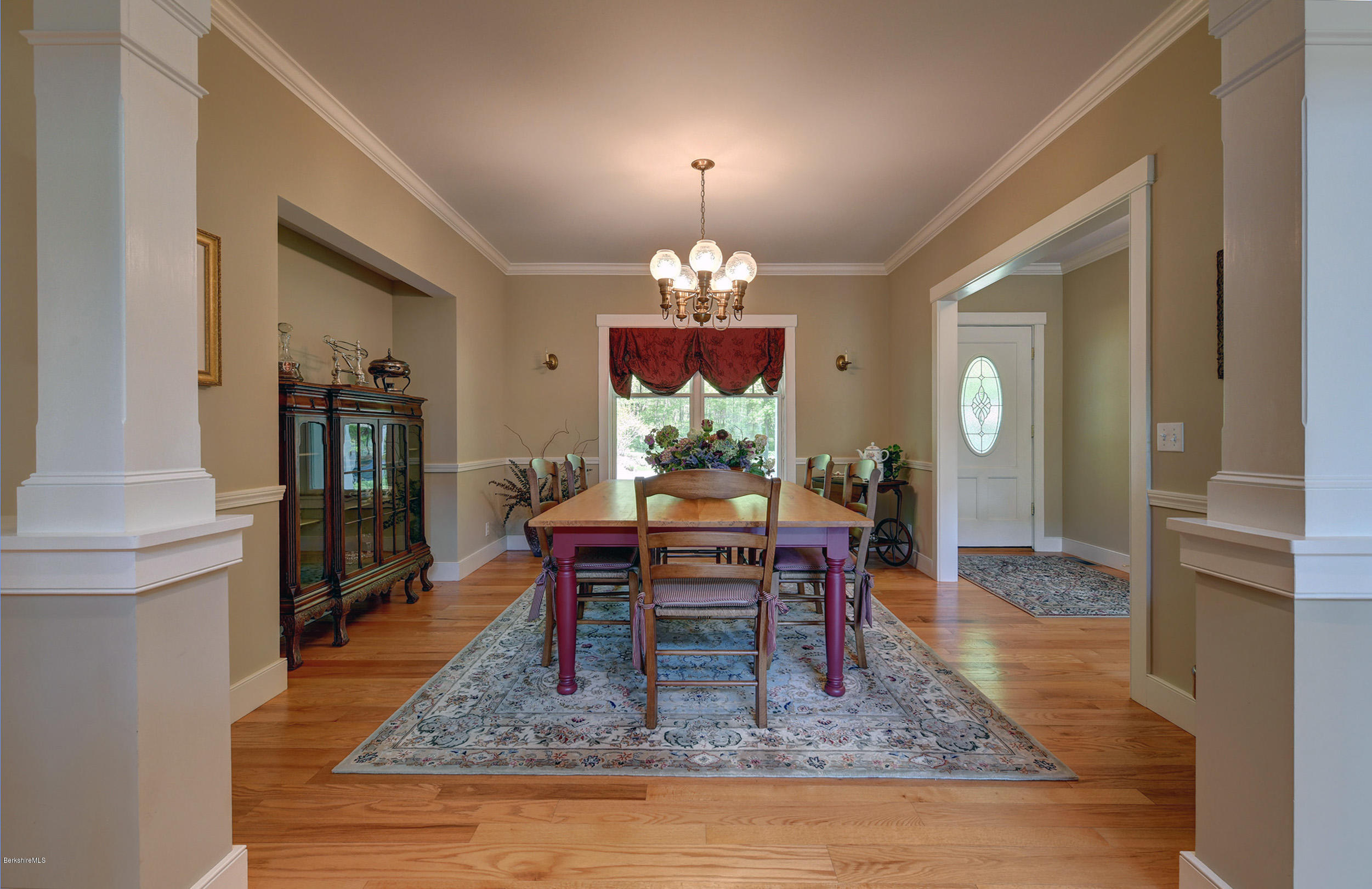 28 Austerlitz Road West Stockbridge, MA 01266 - Photo 13 of 44 a dining room with wooden floor a chandelier a wooden table and chairs